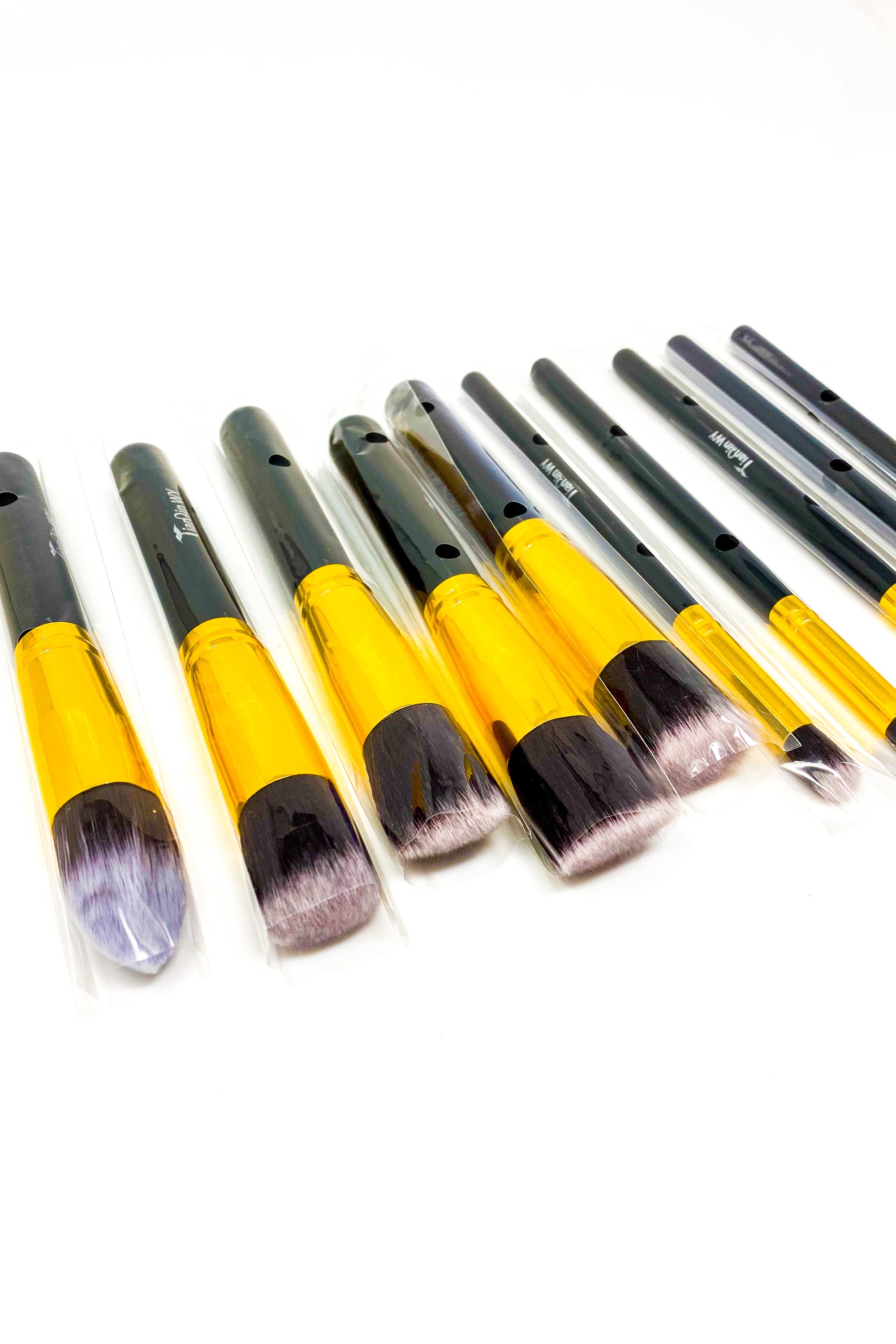 Everything Beat 10 Piece Makeup Brush Set featuring various brushes in multiple colors with a resealable storage tote.