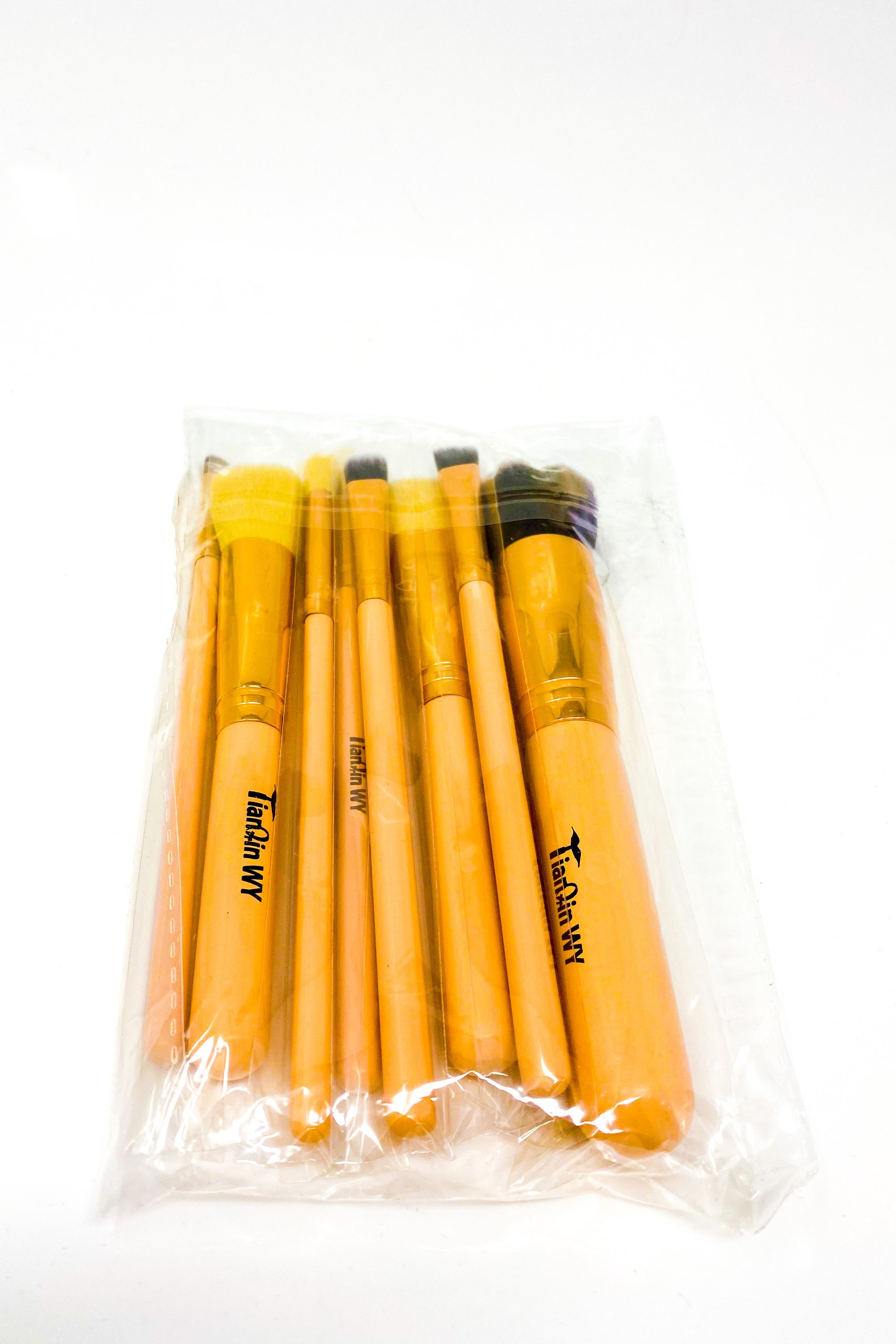 Everything Beat 10 Piece Makeup Brush Set featuring various brushes in multiple colors with a resealable storage tote.