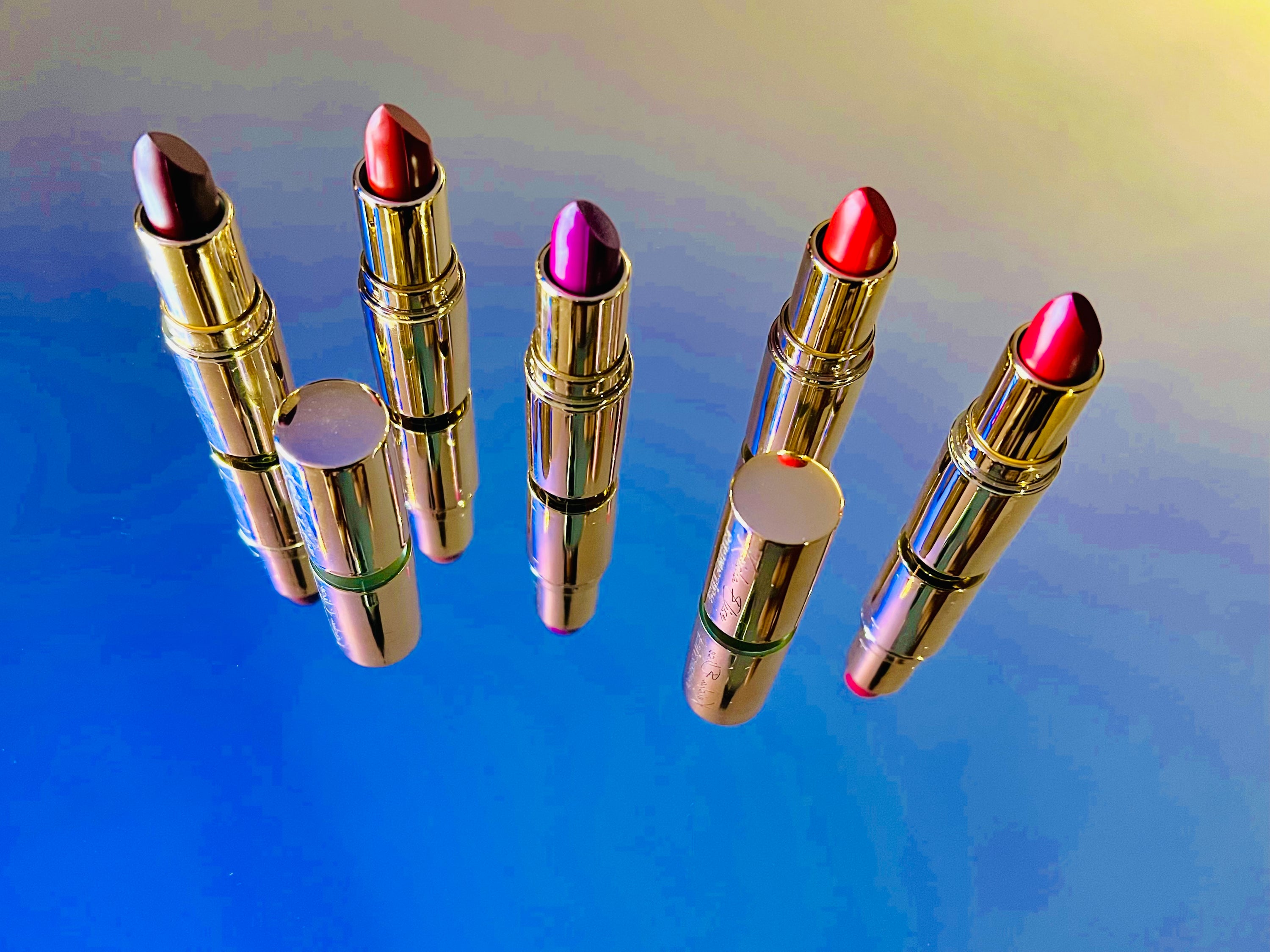 A collection of Matte Lipsticks in various shades, showcasing their sleek packaging and vibrant colors.