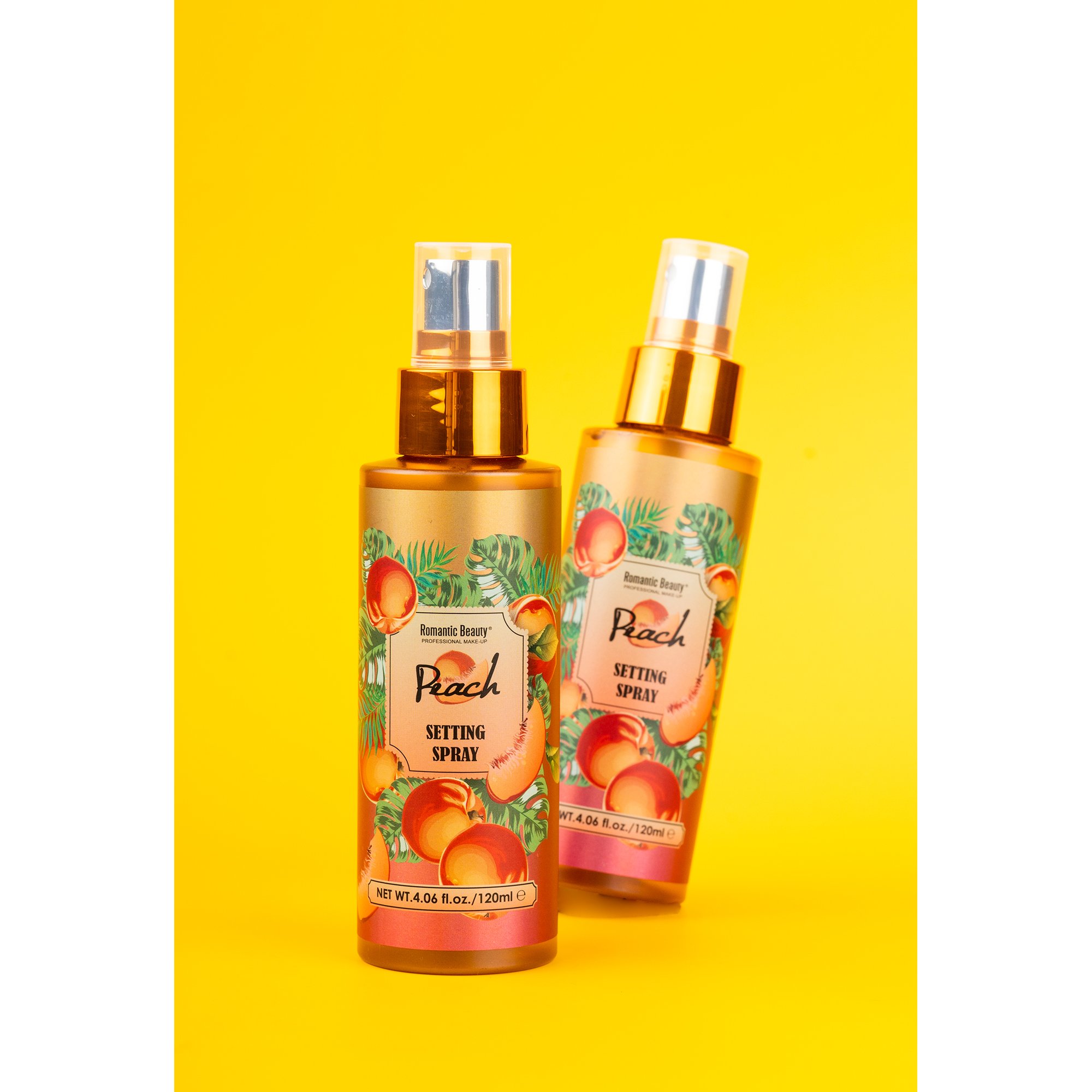 Peach Perfect Stay Setting Spray in an elegant glass bottle with gold flakes, designed for flawless makeup application.