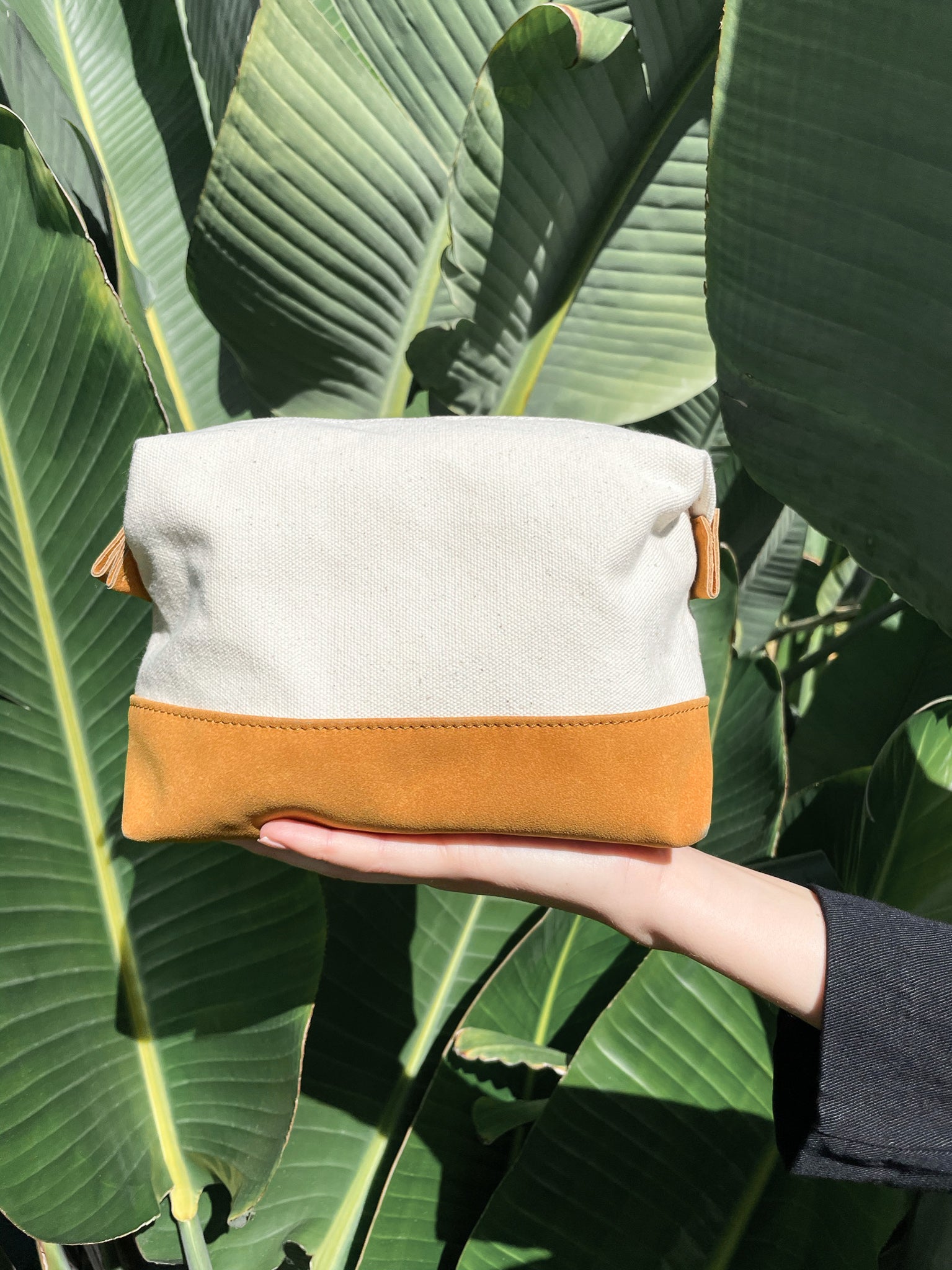 Travel Buddy Toiletry Bag in Bliss Curry/Cream, featuring a stylish design with snap-down sides and a secure zipper compartment.