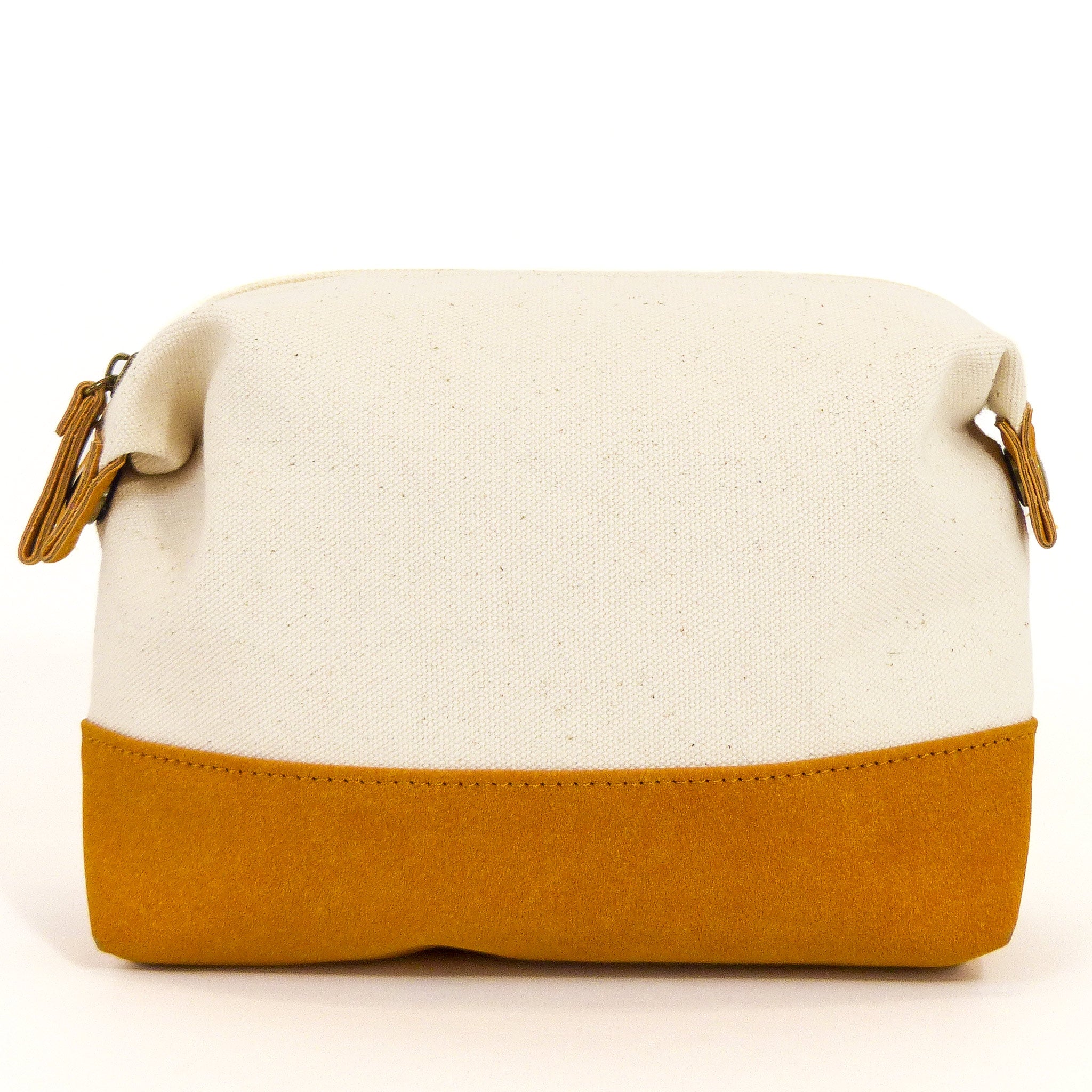 Travel Buddy Toiletry Bag in Bliss Curry/Cream, featuring a stylish design with snap-down sides and a secure zipper compartment.