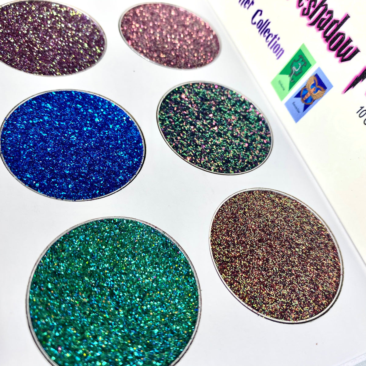 Wizarding World Chameleon Multichrome Glitter Eyeshadow Palette showcasing vibrant pinks, violets, golds, and greens in a sleek design.