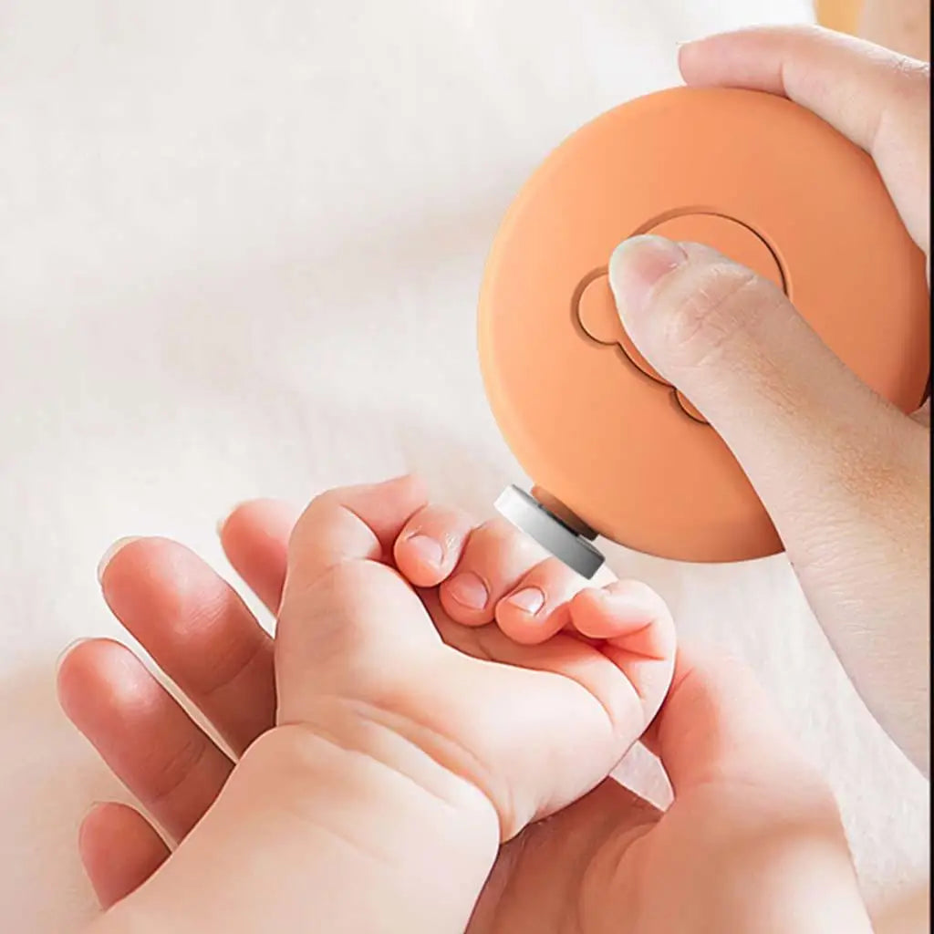 Baby Electric Nail File with six grinding heads, ergonomic design, and bear-shaped button for easy operation.