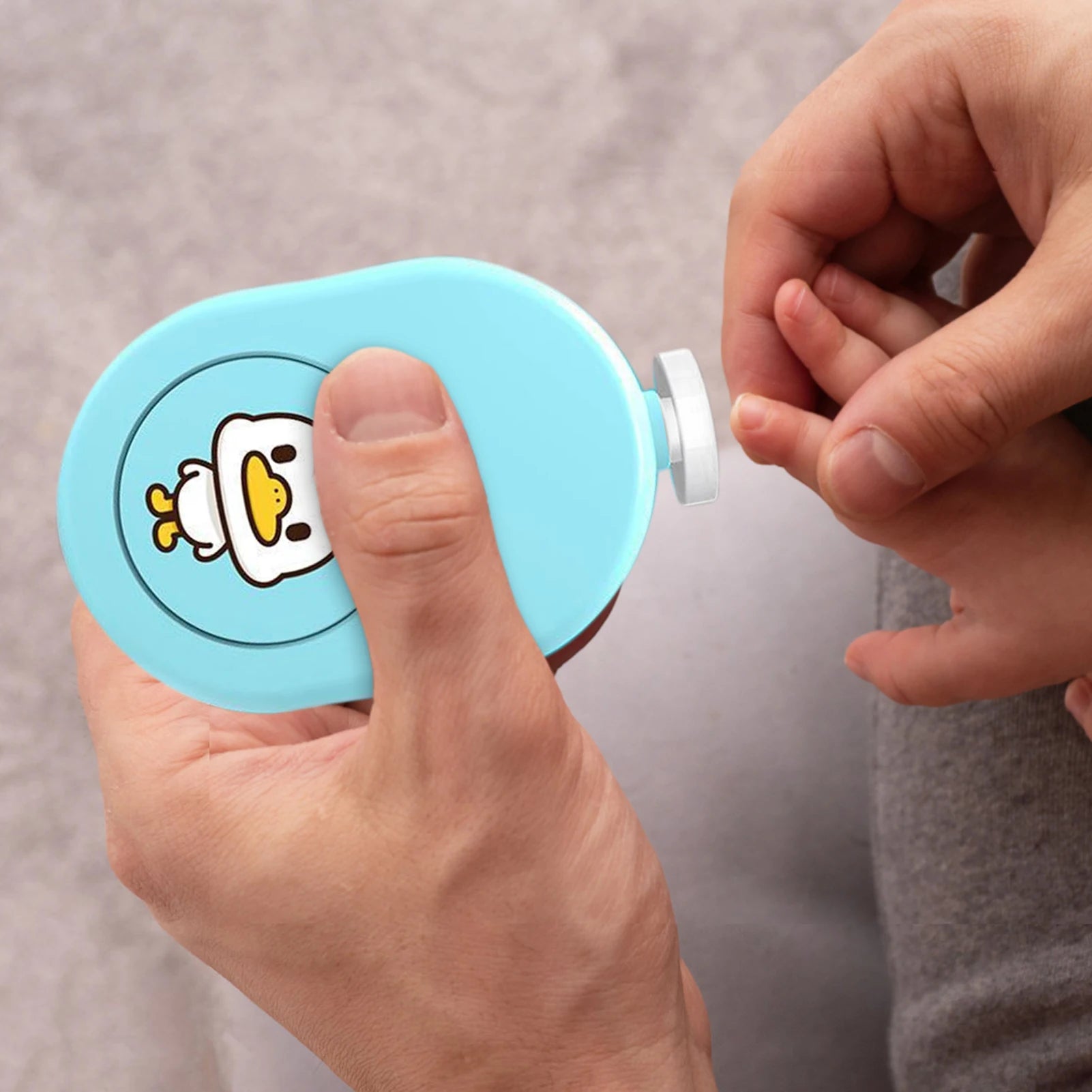 A compact and lightweight baby nail file designed for infants and toddlers, featuring a gentle electric trimmer with multiple contact pads.