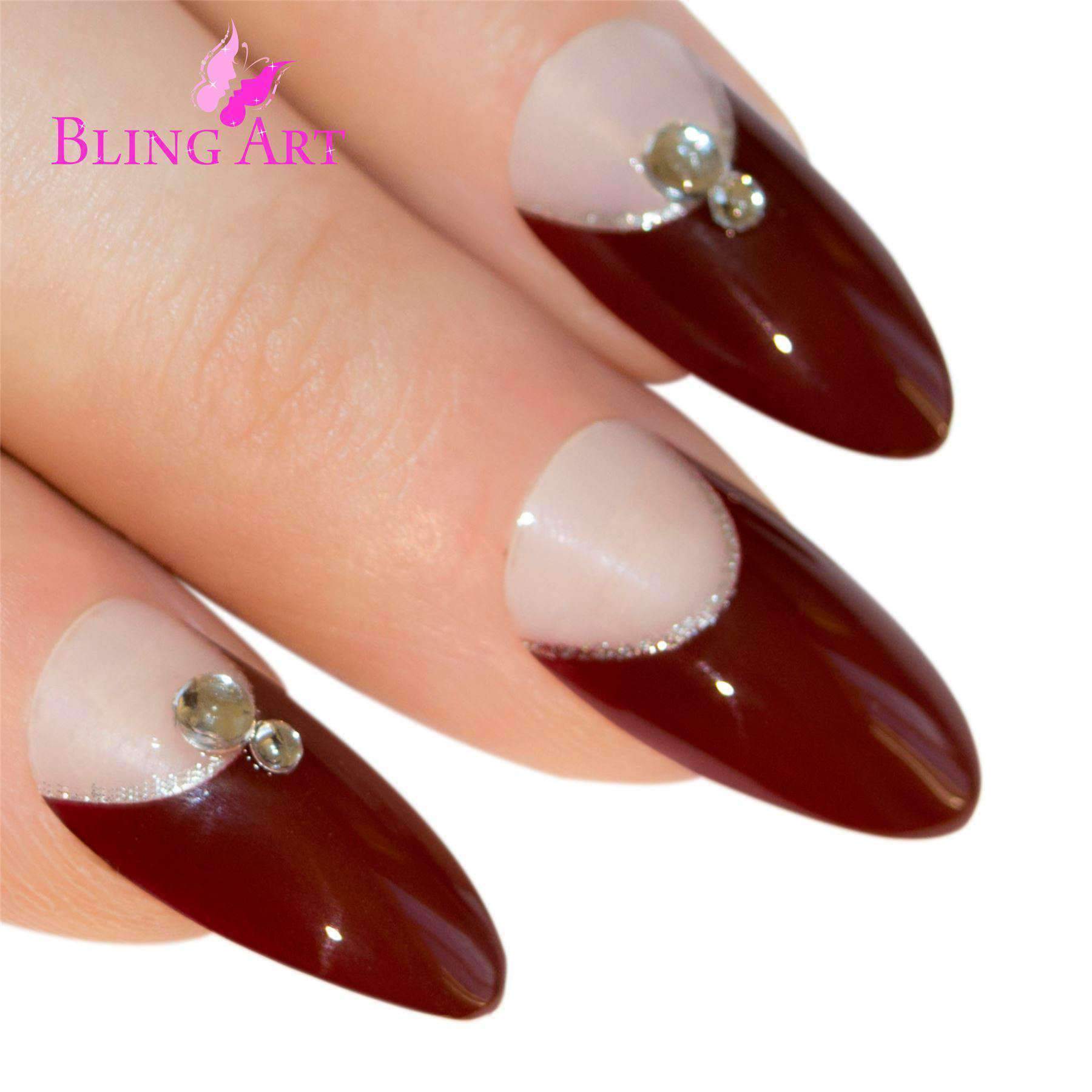 A set of Bling Art Red Brown Almond Stiletto Long Fake Acrylic Tips featuring elegant crystal details, including 24 nails in various sizes, glue, nail file, and cuticle stick.