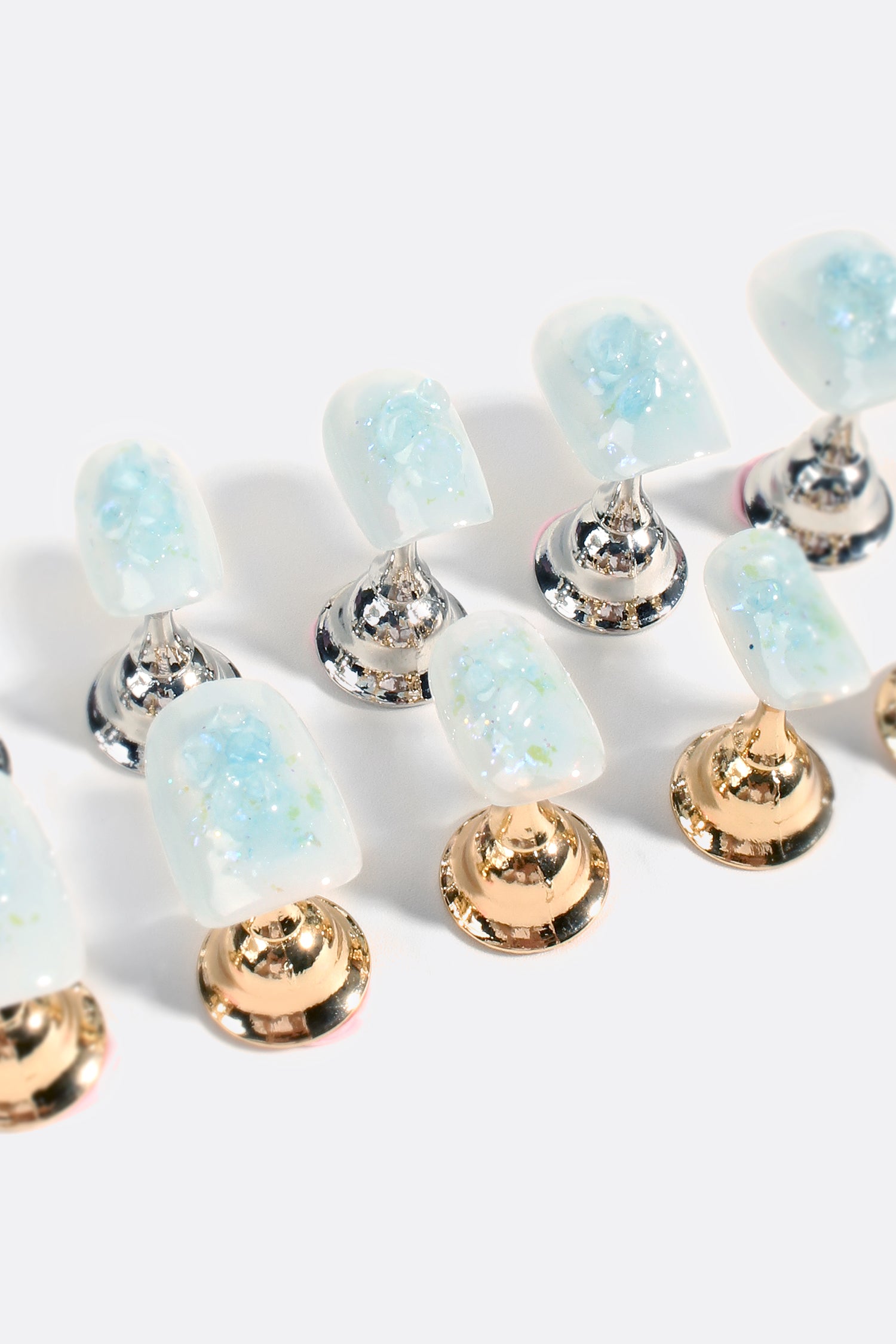 Glacial Gleam Pro Handmade Gel Nails featuring a cool base with iridescent flakes, showcasing a sophisticated winter design.