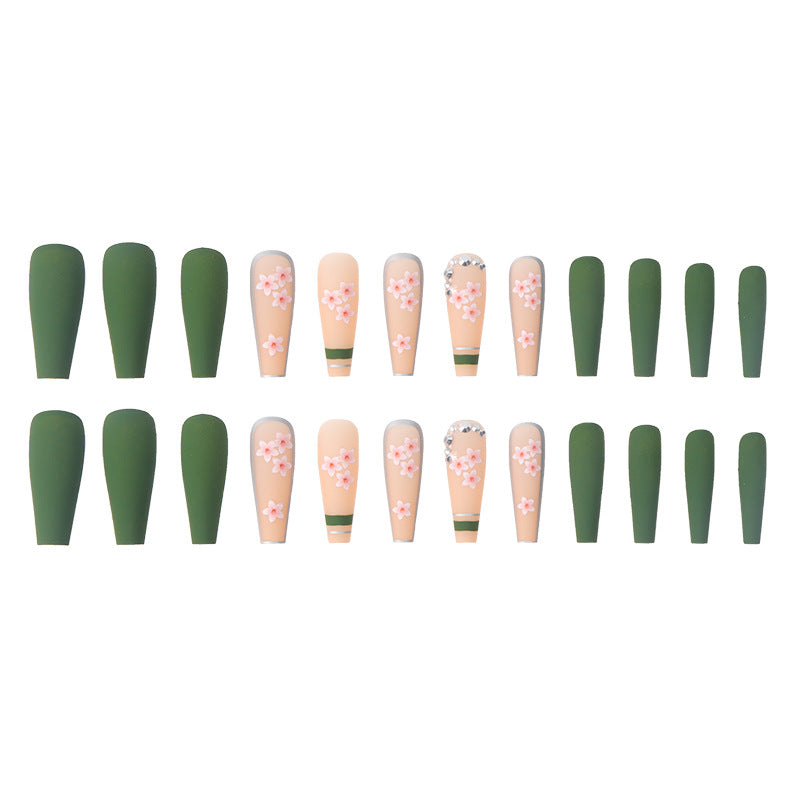 A set of 24 colorful fake nails featuring spring flower designs, including both frosted and glossy finishes, neatly arranged in a box.