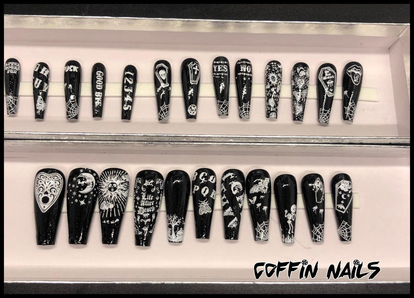 A set of 24 Ouija Board themed press on nails in stiletto, coffin, and short styles, showcasing unique designs and colors.