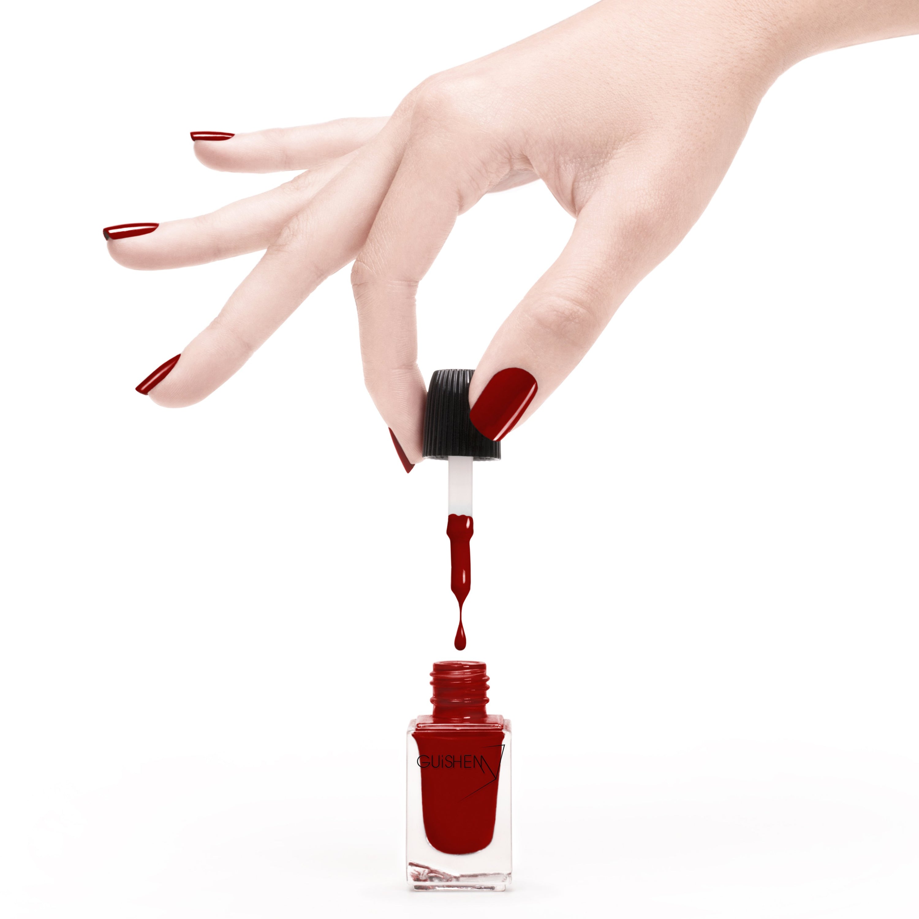 GUiSHEM Premium Nail Lacquer in TRUE RED, showcasing a sleek glass bottle and custom brush for easy application.