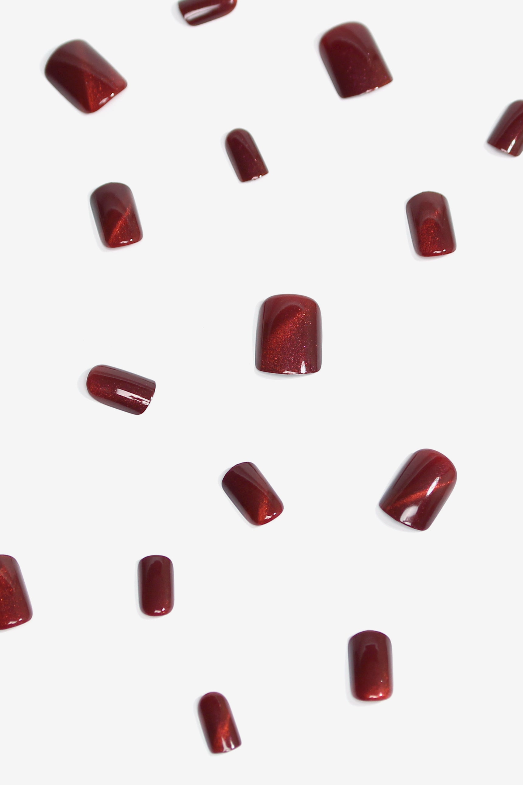 Starlite Red Press-On Nails featuring a glittery deep red design, perfect for glamorous manicures.