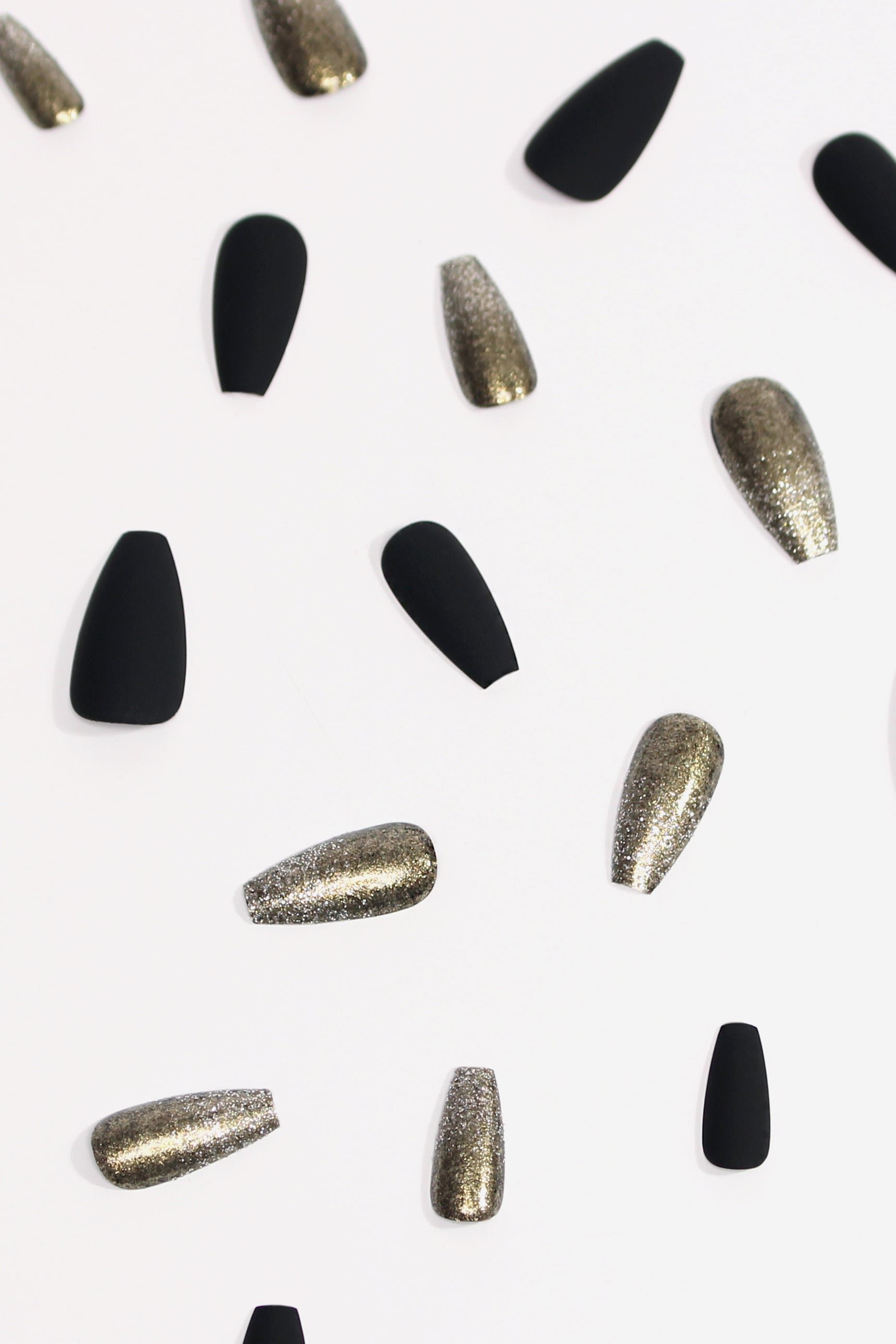 Stella press-on nails featuring a matte finish with metallic powder glitter, showcasing a celestial design perfect for stylish manicures.