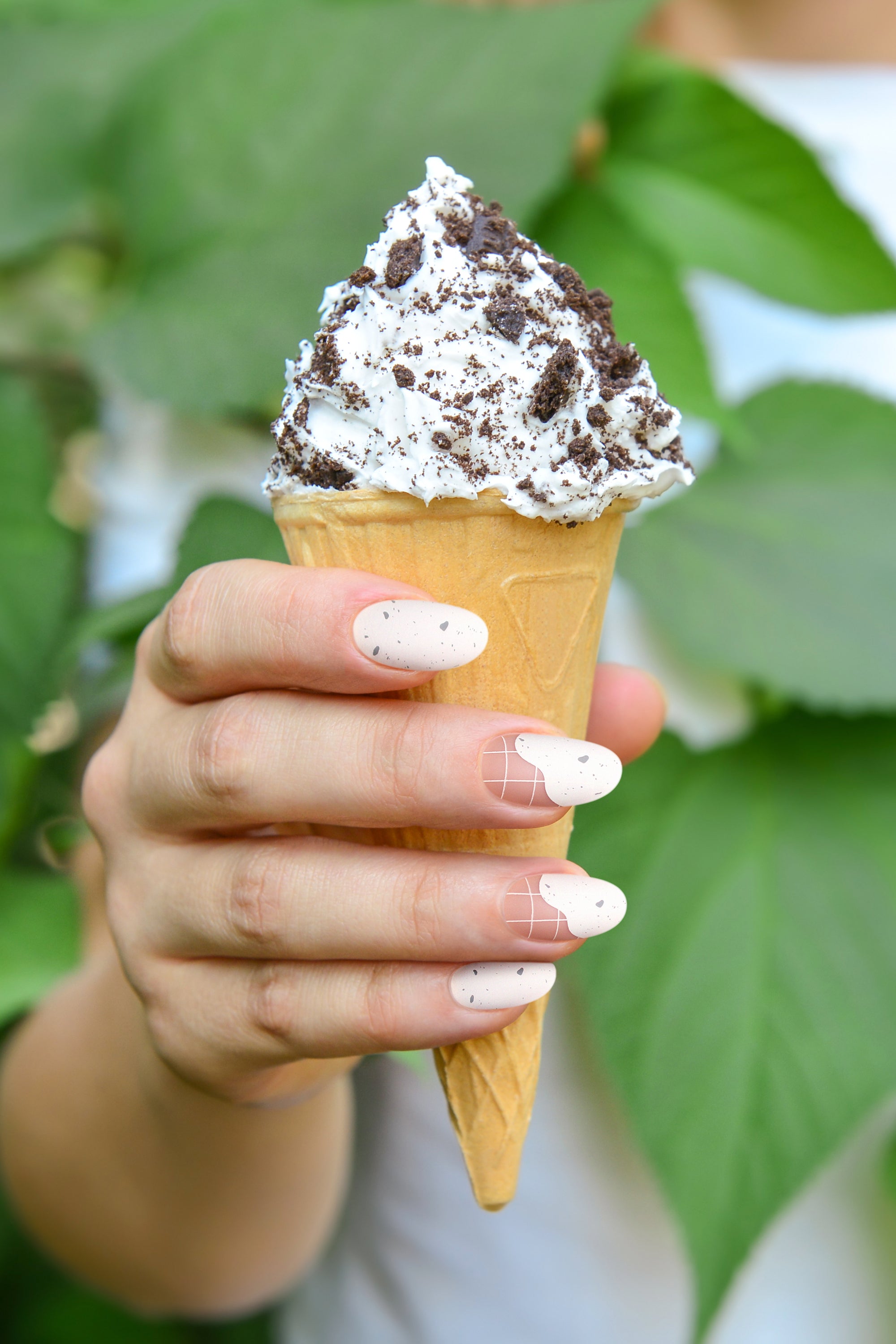 Sundaes and Cones press-on nails featuring a speckled pattern on a matte backdrop, inspired by vanilla chocolate chip ice cream.