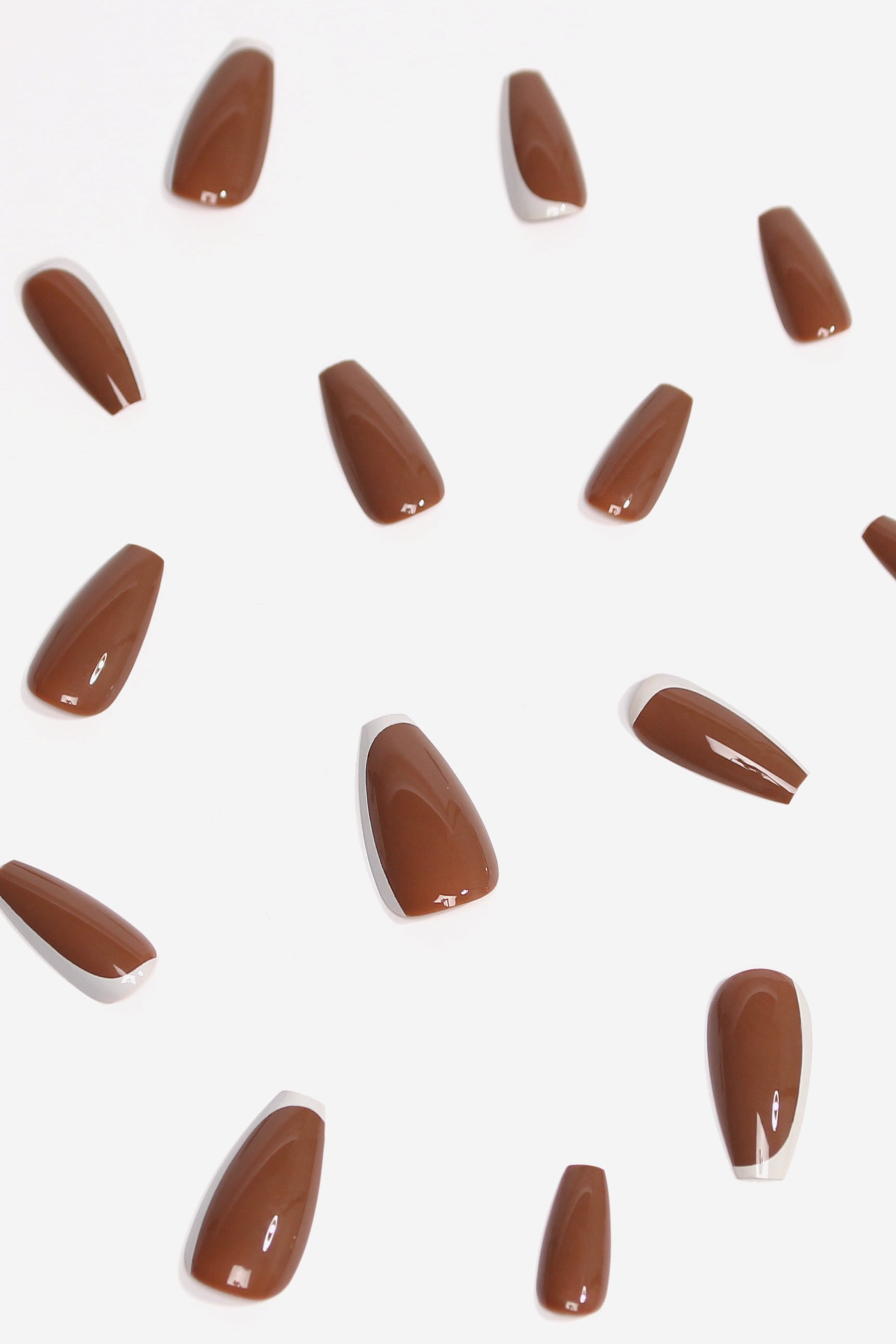 Toffee Nut press-on nails in a rich, warm hue with a glossy finish, showcasing their elegant design and variety of sizes.