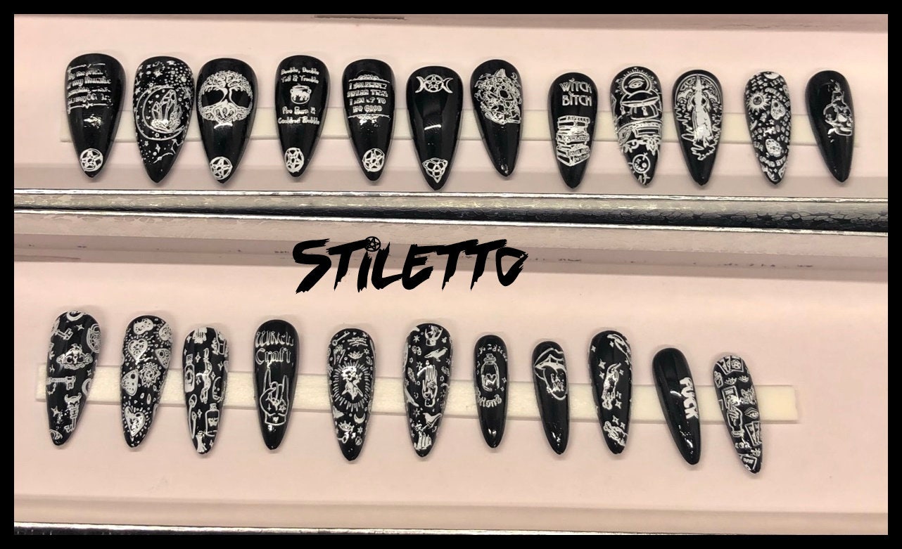 A set of 24 witch-themed press on nails in various styles including stiletto, coffin, and short, showcasing unique designs and colors.