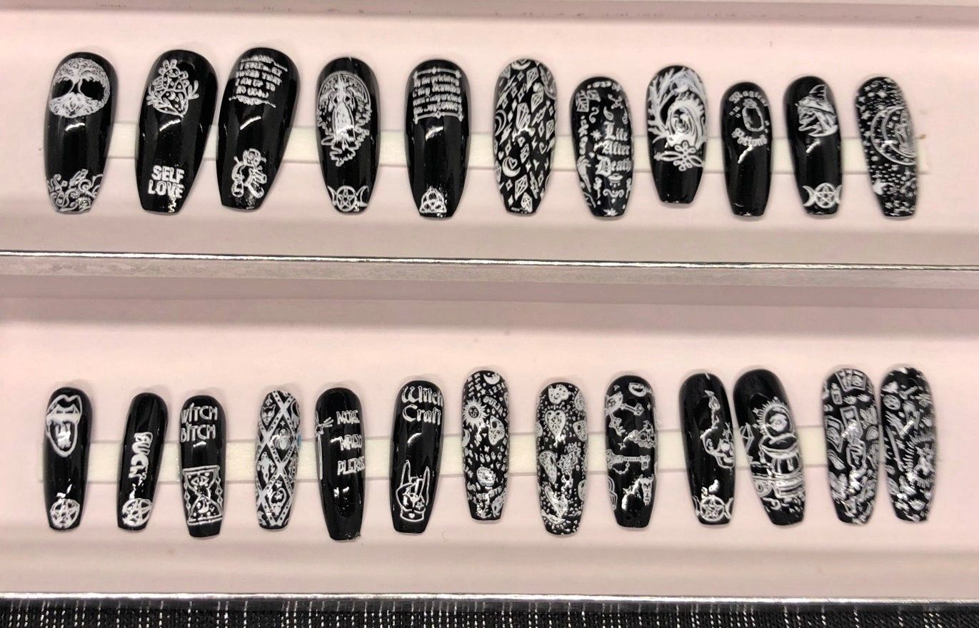 A set of 24 witch-themed press on nails in various styles including stiletto, coffin, and short, showcasing unique designs and colors.