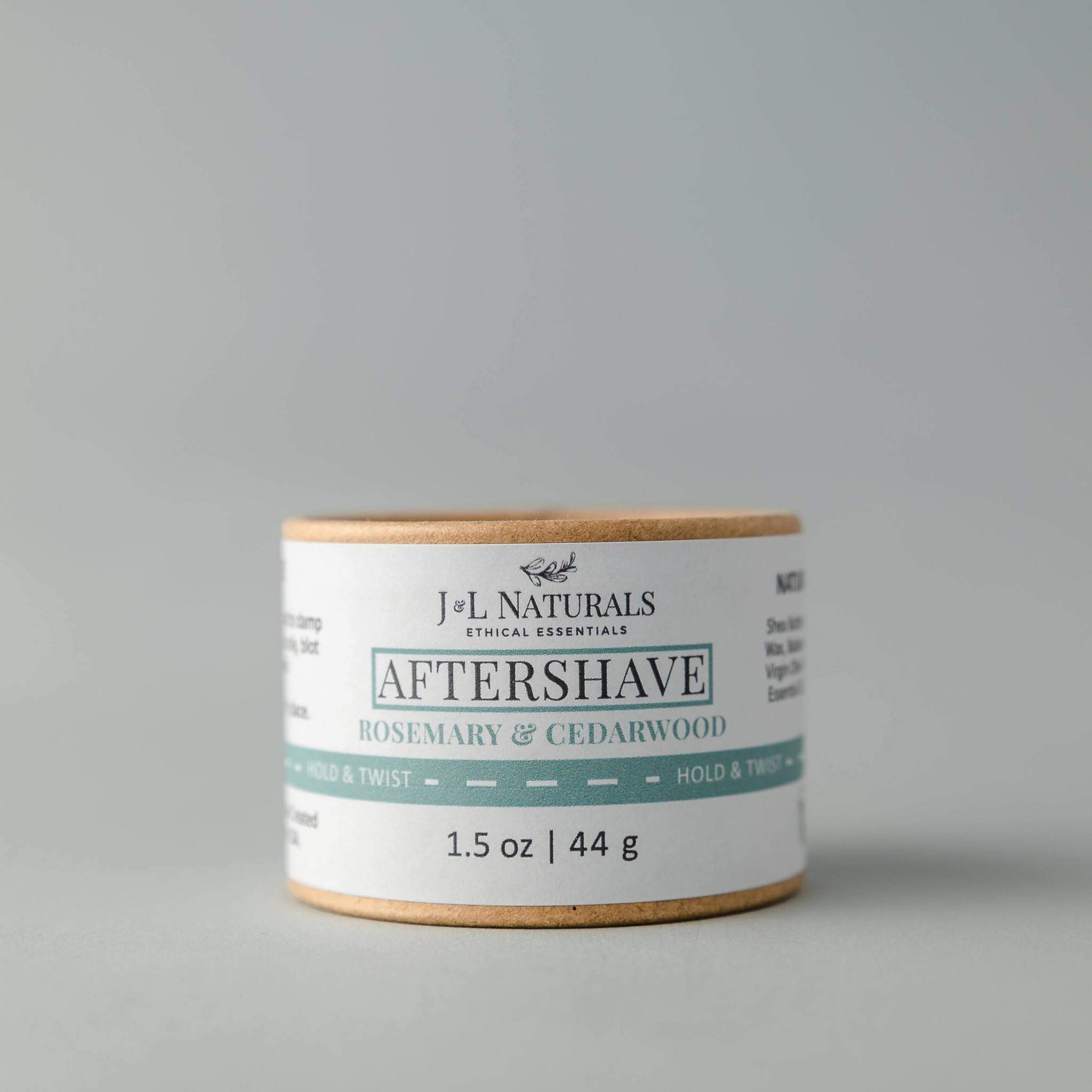 A soothing Aftershave Rub in a 1.5 oz container, showcasing its buttery texture and natural ingredients.