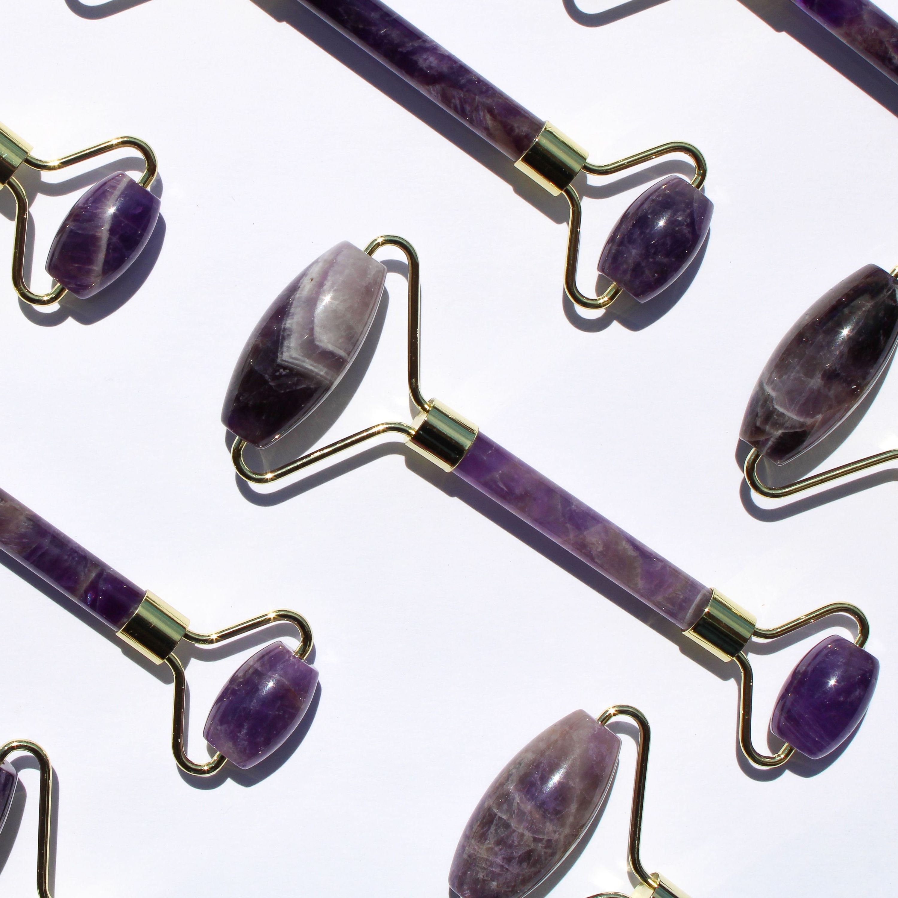 Amethyst Facial Roller with a smooth, polished surface, showcasing its beautiful purple hue and dual-ended design for facial massage.