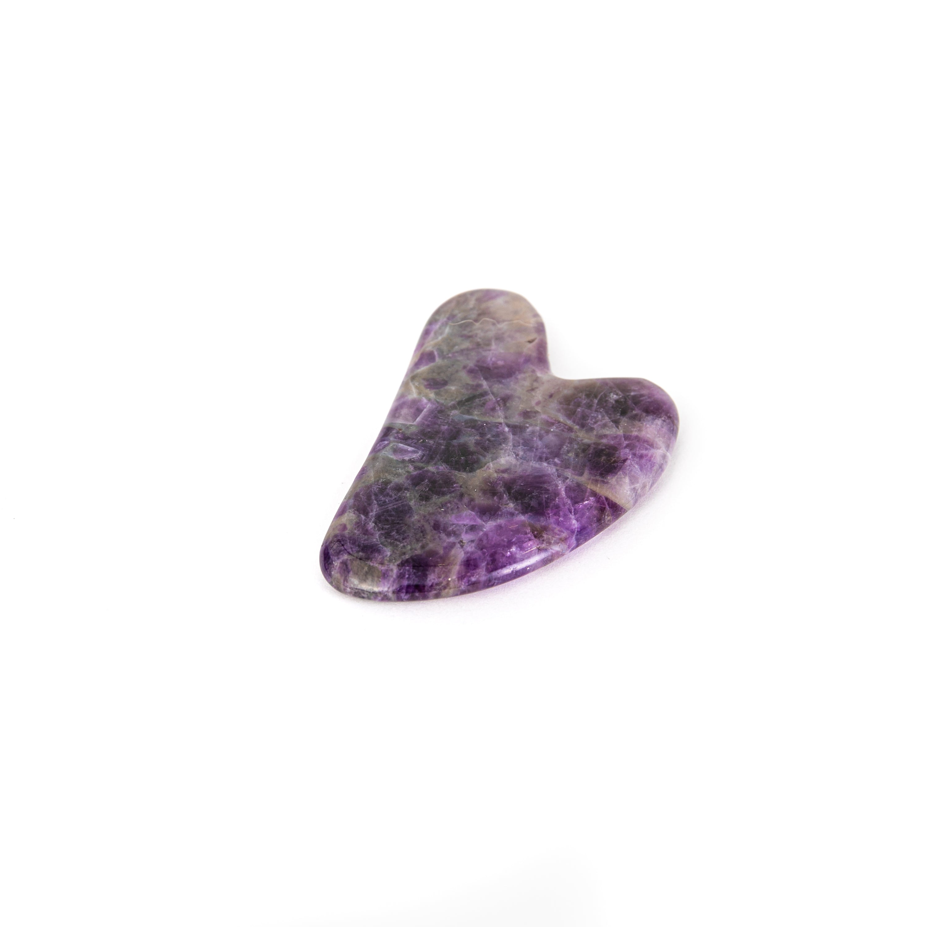 Amethyst Gua Sha facial massage tool, handcrafted with a smooth surface for skin rejuvenation and relaxation.