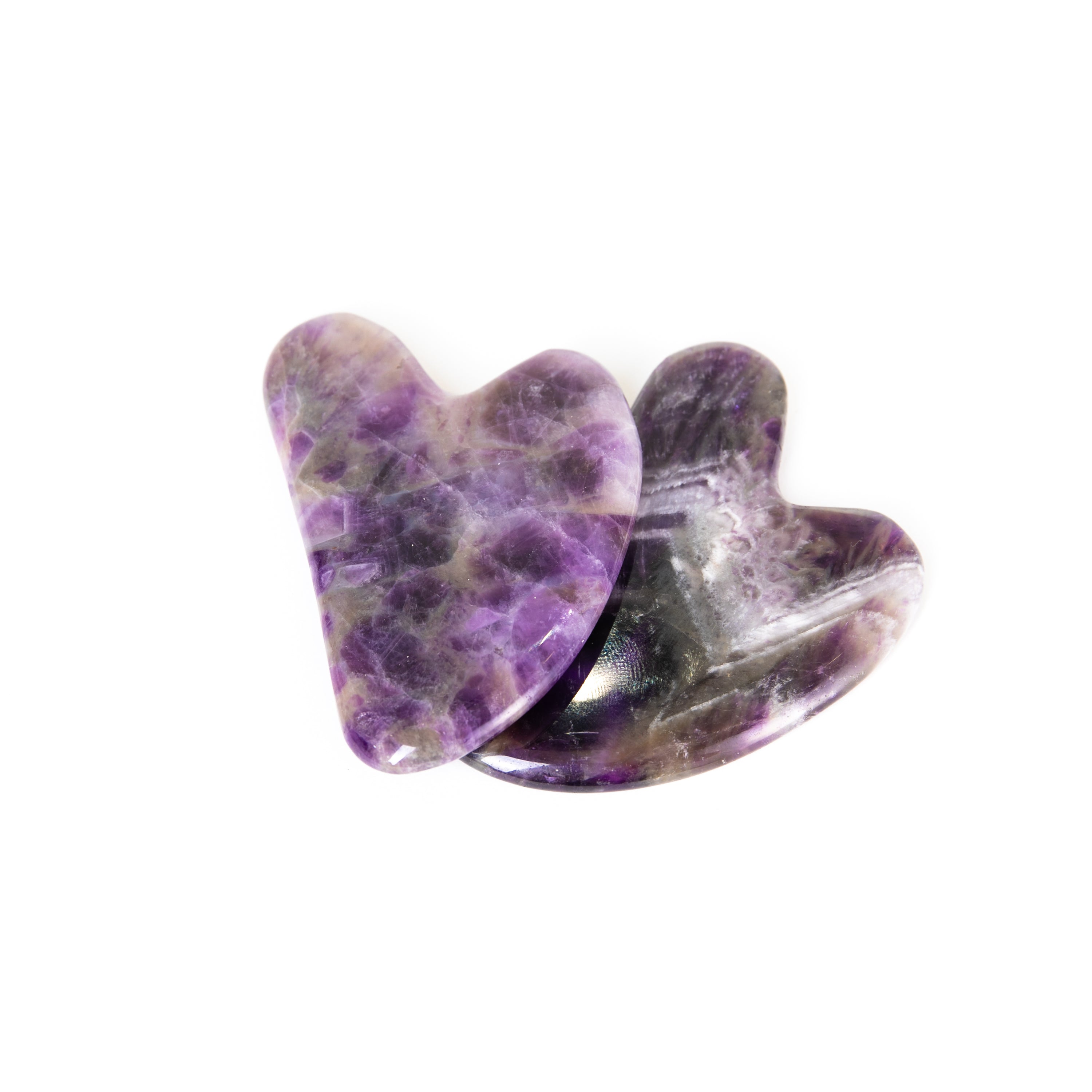 Amethyst Gua Sha facial massage tool, handcrafted with a smooth surface for skin rejuvenation and relaxation.