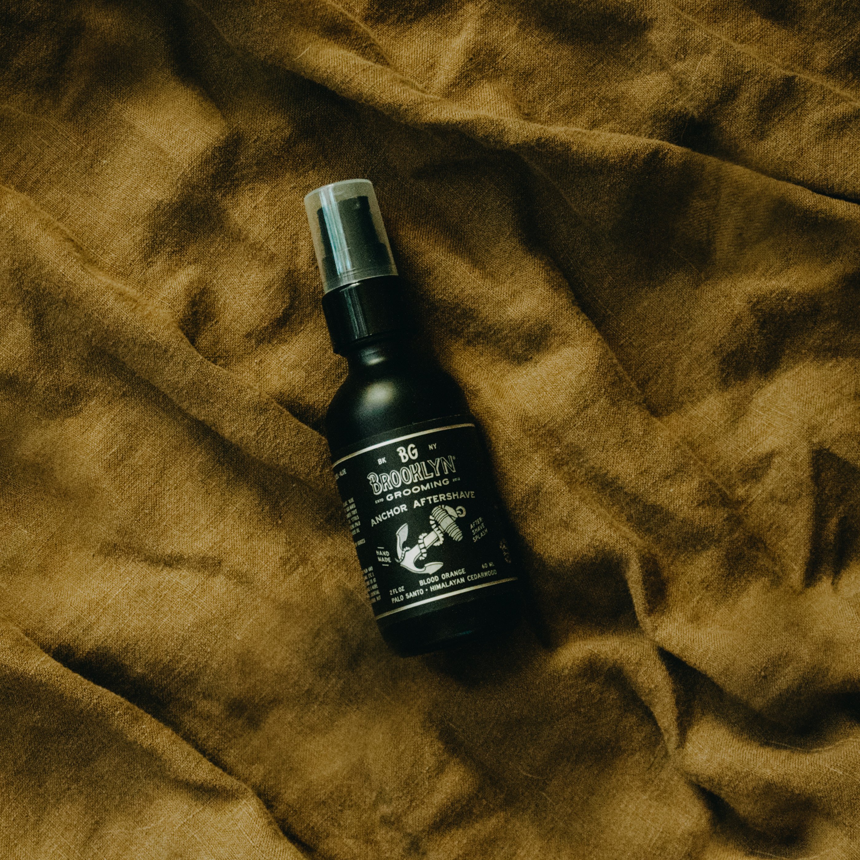 ANCHOR Aftershave Tonic bottle with a nautical design, featuring organic ingredients like cucumber and aloe vera.