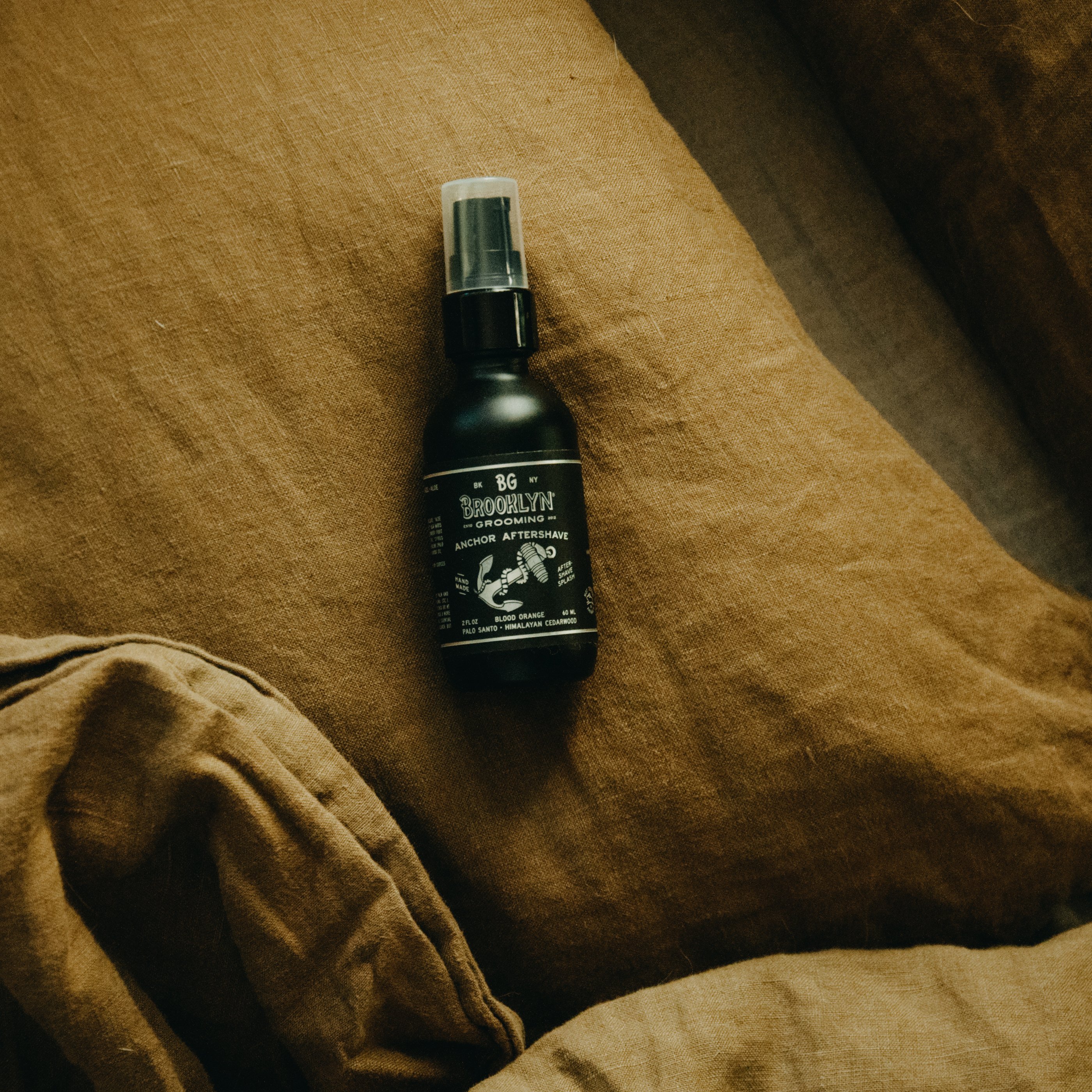 ANCHOR Aftershave Tonic bottle with a nautical design, featuring organic ingredients like cucumber and aloe vera.