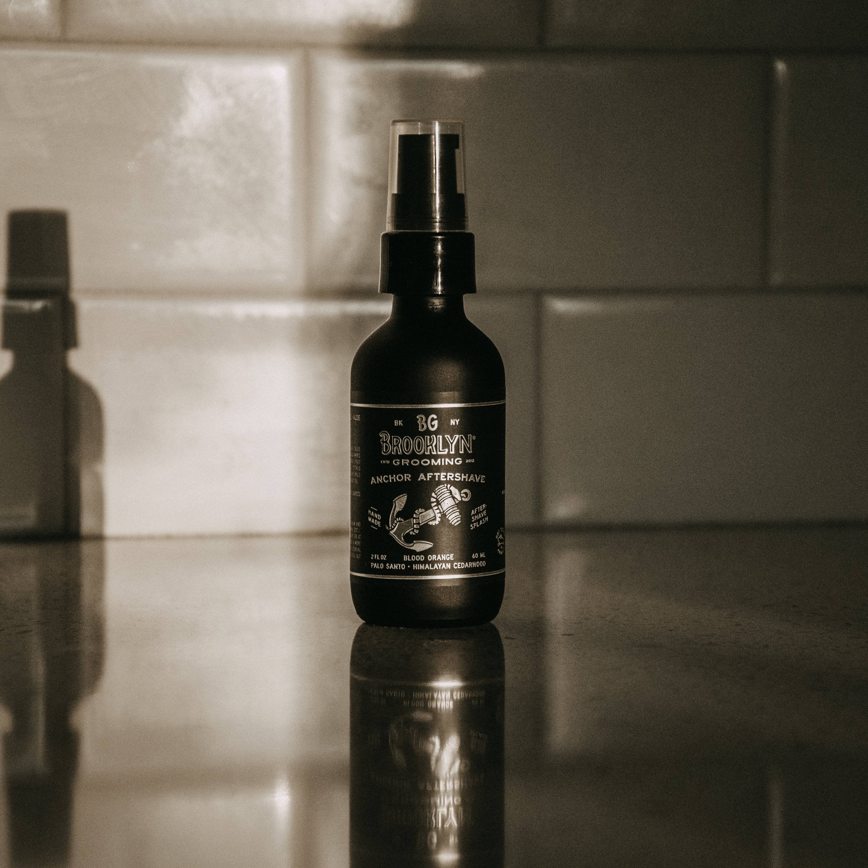 ANCHOR Aftershave Tonic bottle with a nautical design, featuring organic ingredients like cucumber and aloe vera.