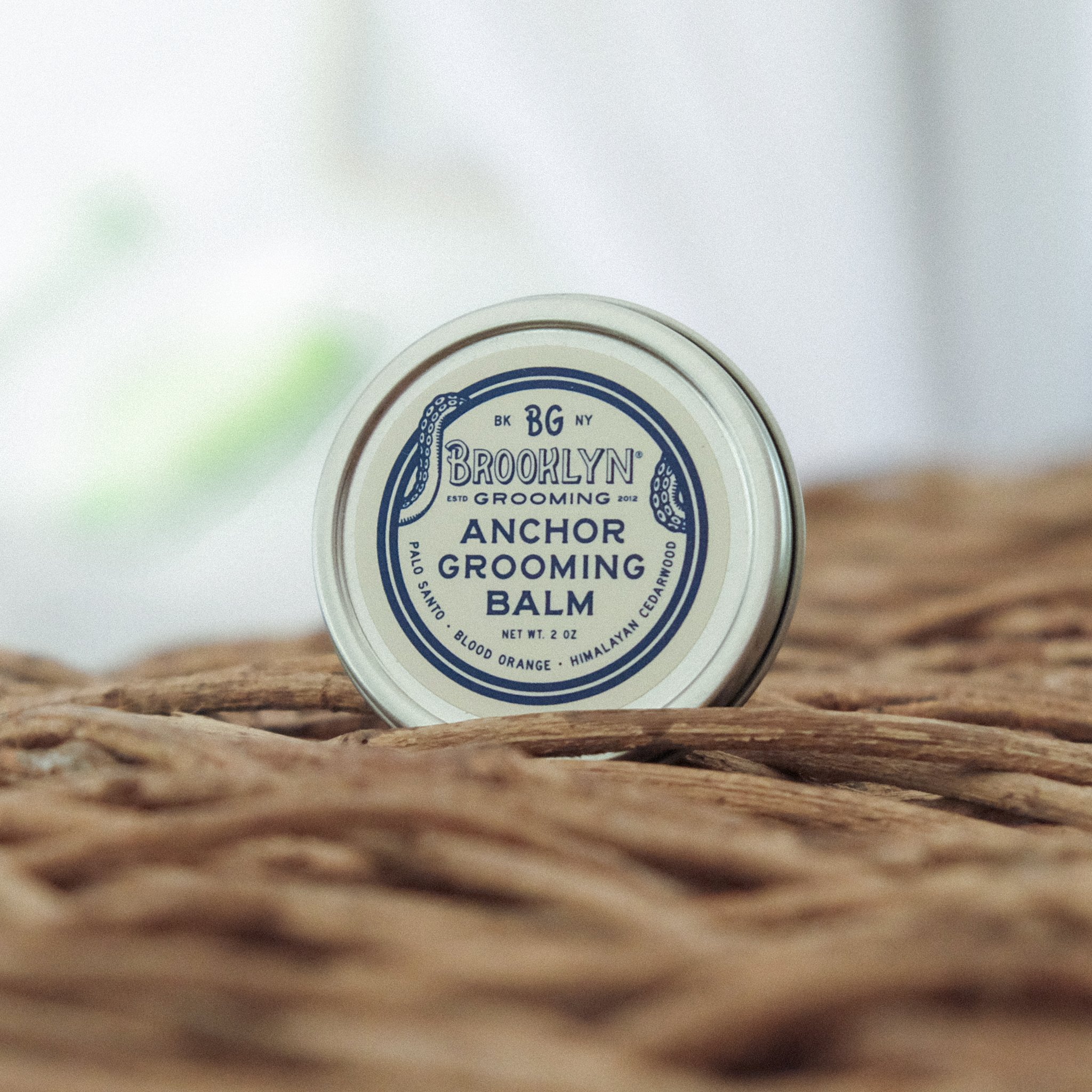 Anchor Grooming Balm in a seamless aluminum tin, showcasing its natural ingredients and unique scent profile.