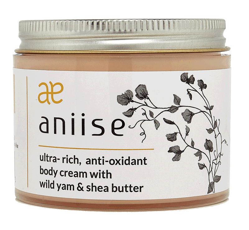 A jar of Anti-Oxidant Wild Yam Body Cream with a soothing texture, surrounded by natural ingredients like wild yam and shea butter.