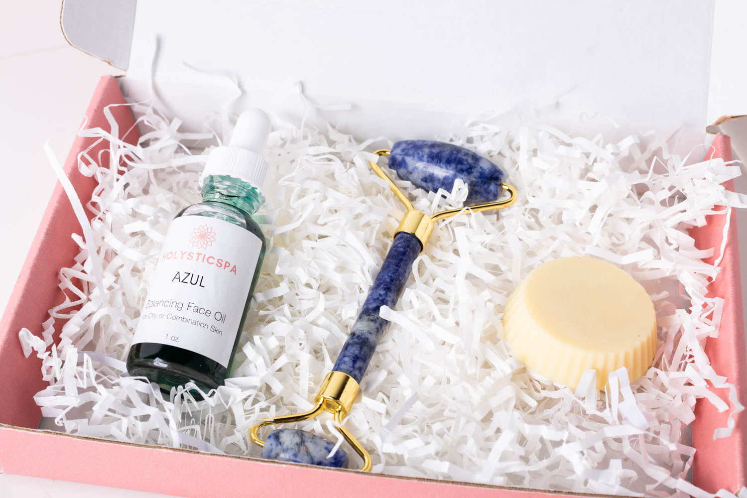 Azul Gift Set featuring face oil, Blue Sodalite face roller, and lotion bar in an elegant gift box.