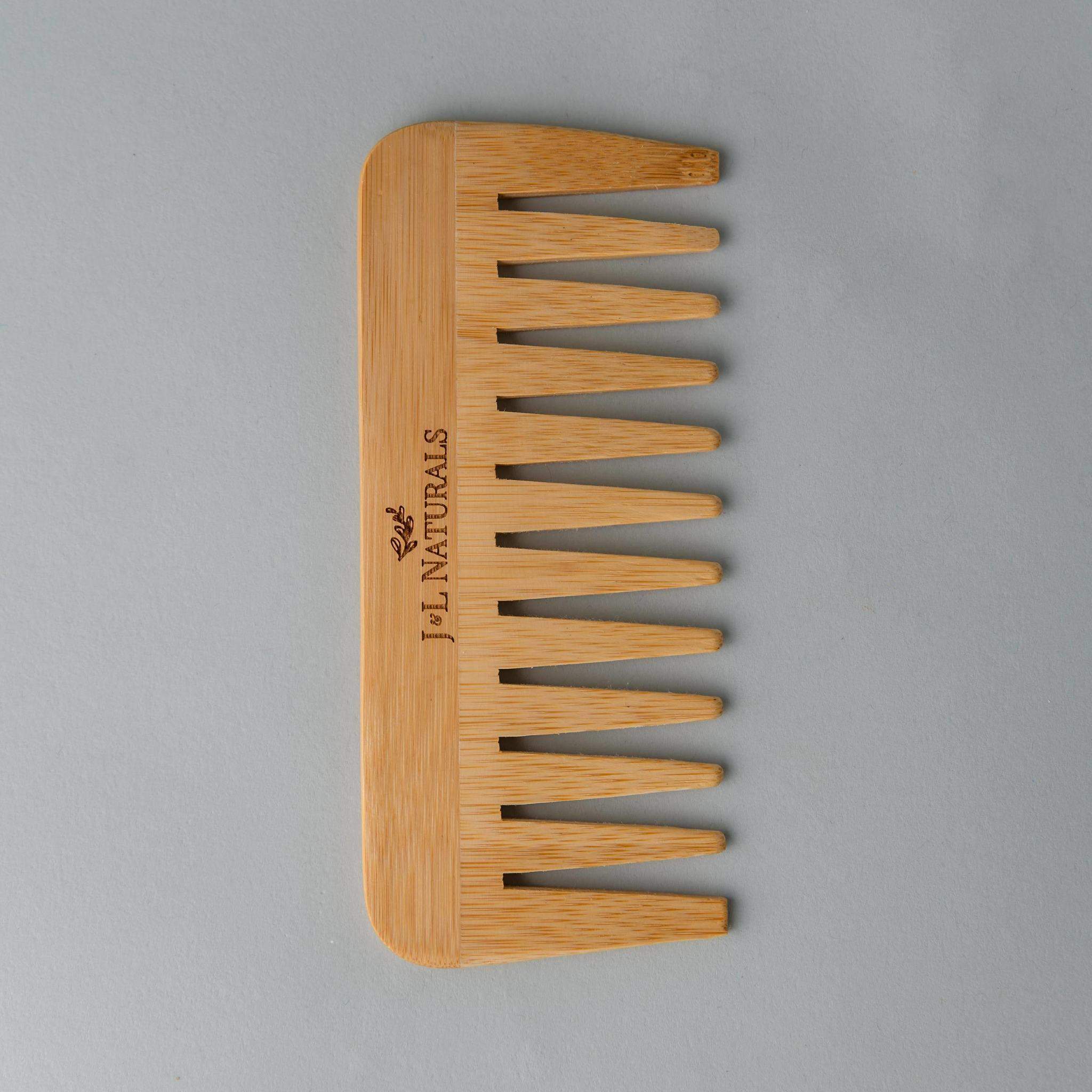 A wide-tooth bamboo detangling comb, perfect for reducing hair breakage and detangling thick or curly hair.