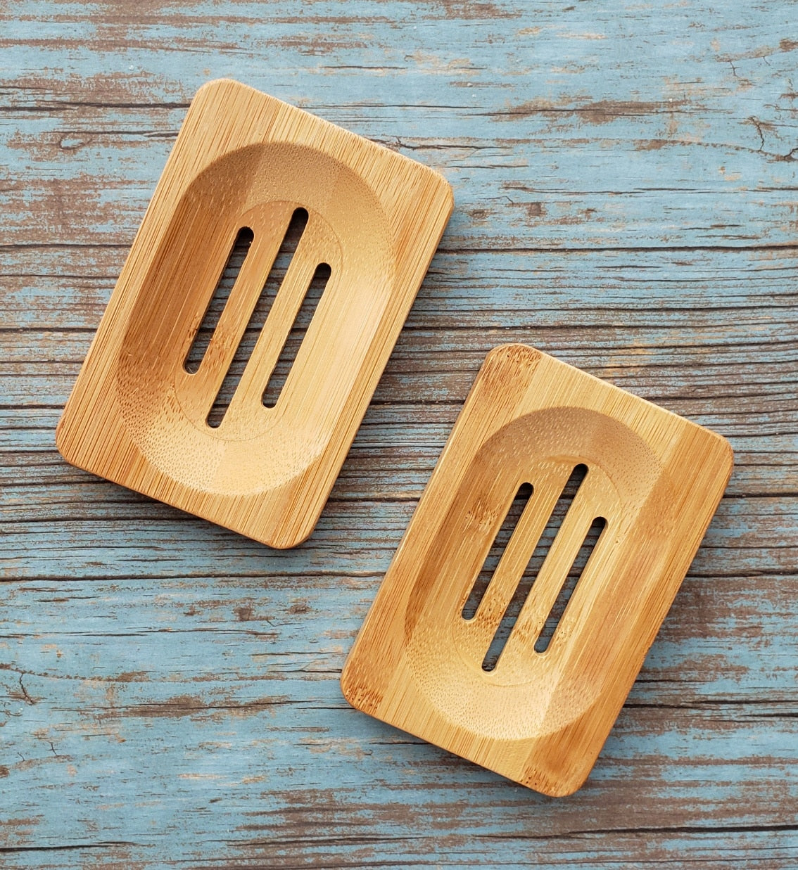 Eco-friendly Bamboo Soap Dish by Morfosoaps with a sloped surface for drainage and a non-slip bottom, showcasing its natural bamboo finish.