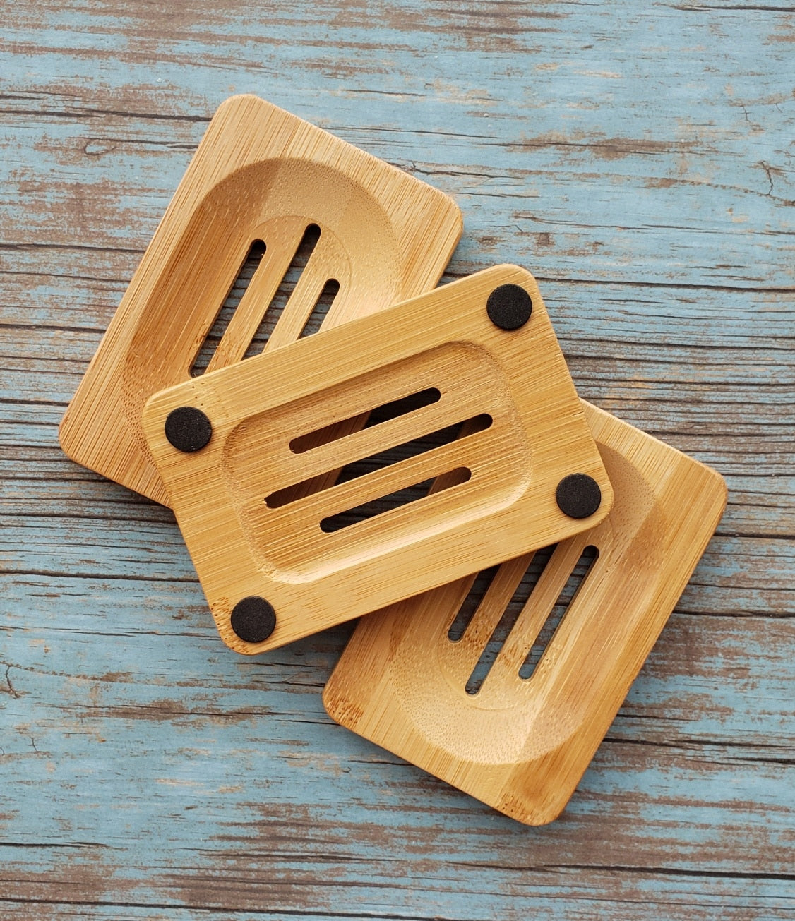 Eco-friendly Bamboo Soap Dish by Morfosoaps with a sloped surface for drainage and a non-slip bottom, showcasing its natural bamboo finish.