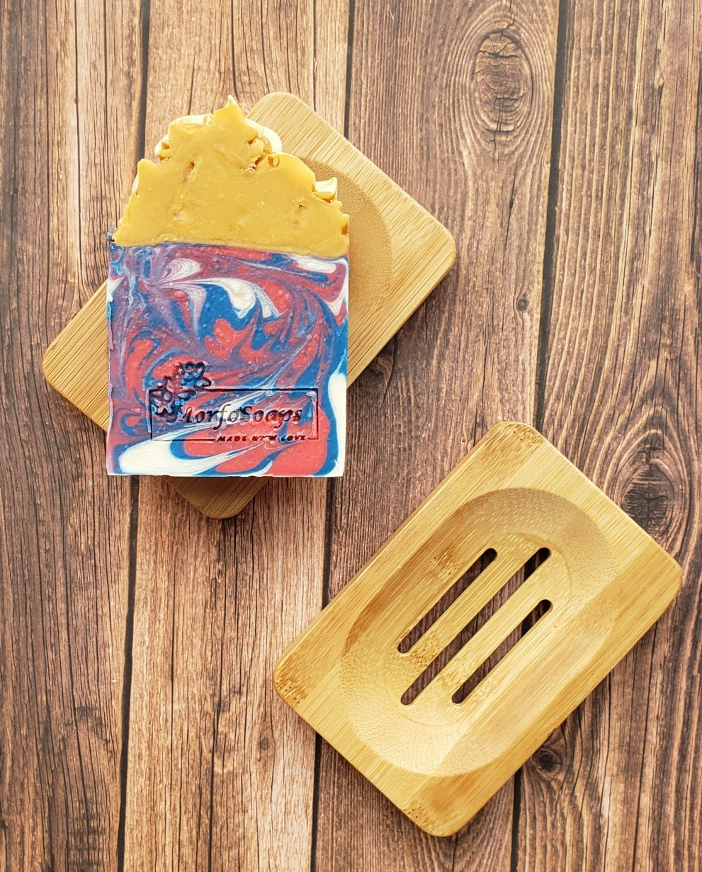 Eco-friendly Bamboo Soap Dish by Morfosoaps with a sloped surface for drainage and a non-slip bottom, showcasing its natural bamboo finish.