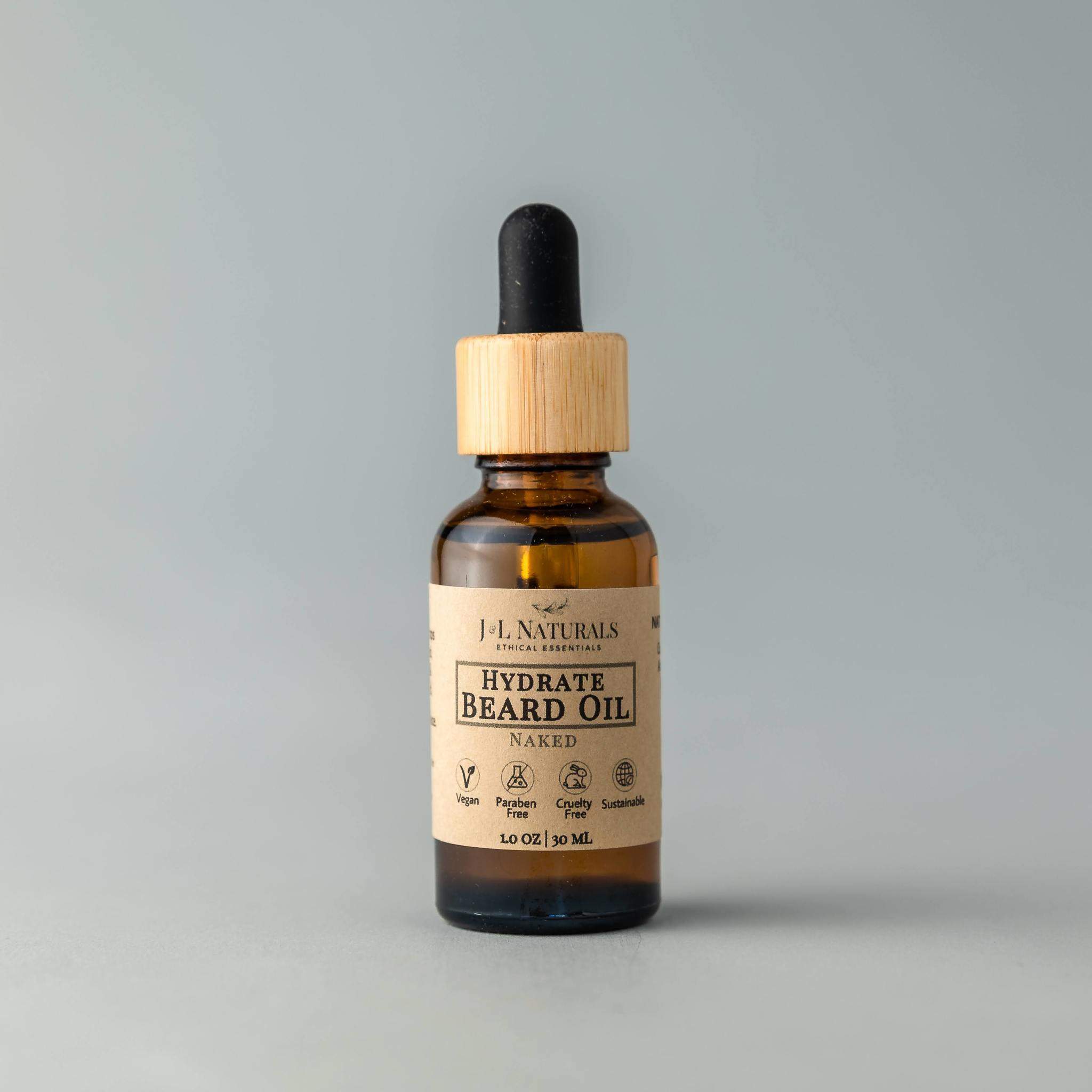 A bottle of Beard Oil with a dropper, showcasing its rich, golden liquid, set against a rustic wooden background.