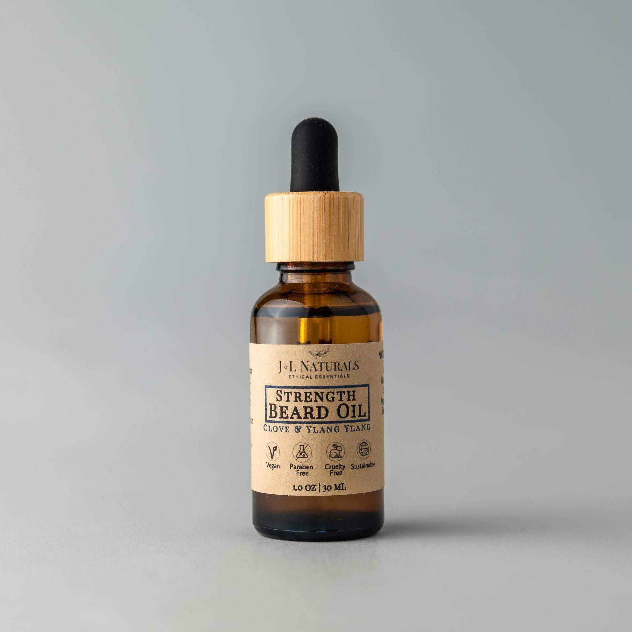 A bottle of Beard Oil with a dropper, showcasing its rich, golden liquid, set against a rustic wooden background.