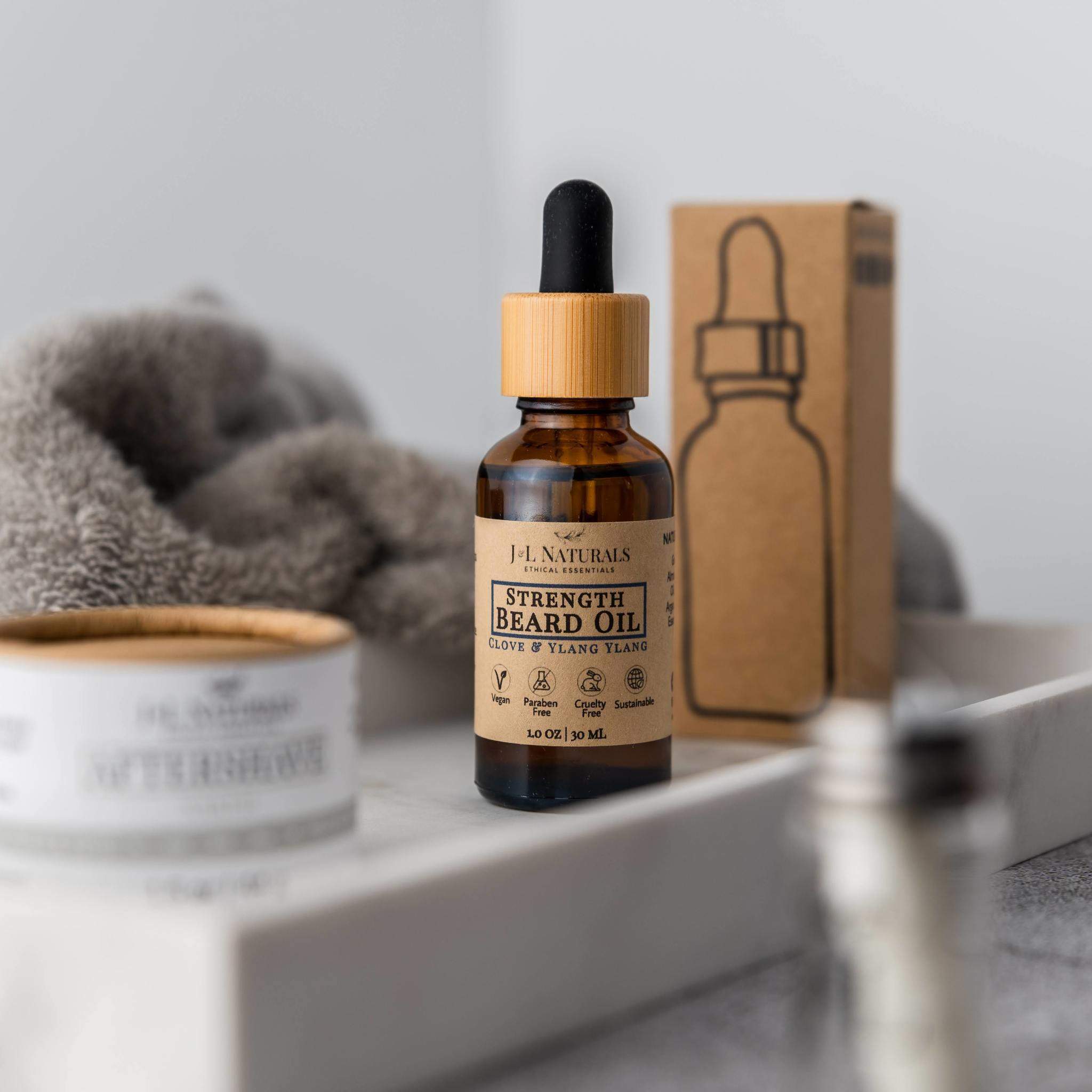 A bottle of Beard Oil with a dropper, showcasing its rich, golden liquid, set against a rustic wooden background.