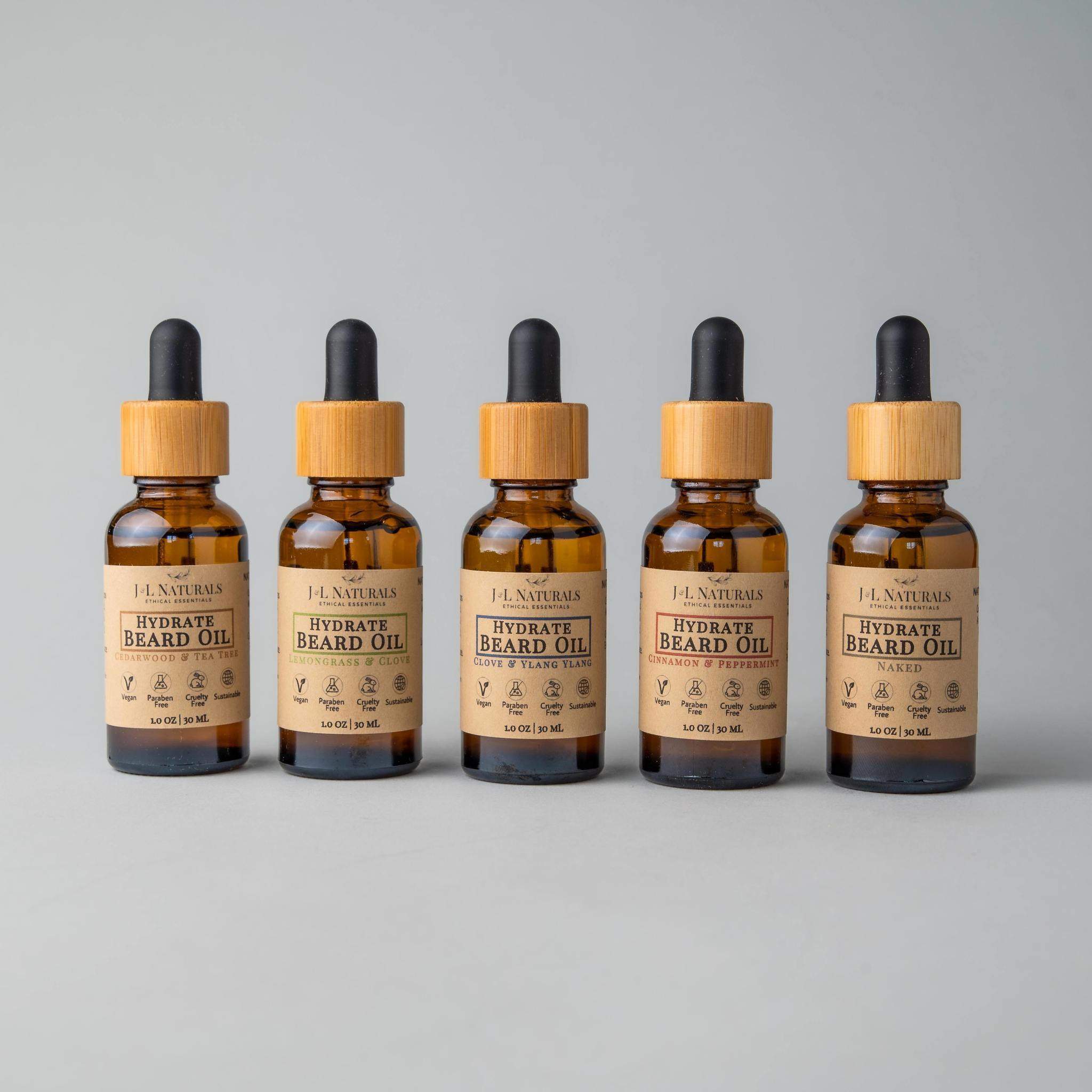 Beard Oil Bundle featuring five bottles of premium grooming oils in various scents, designed for beard care and growth.