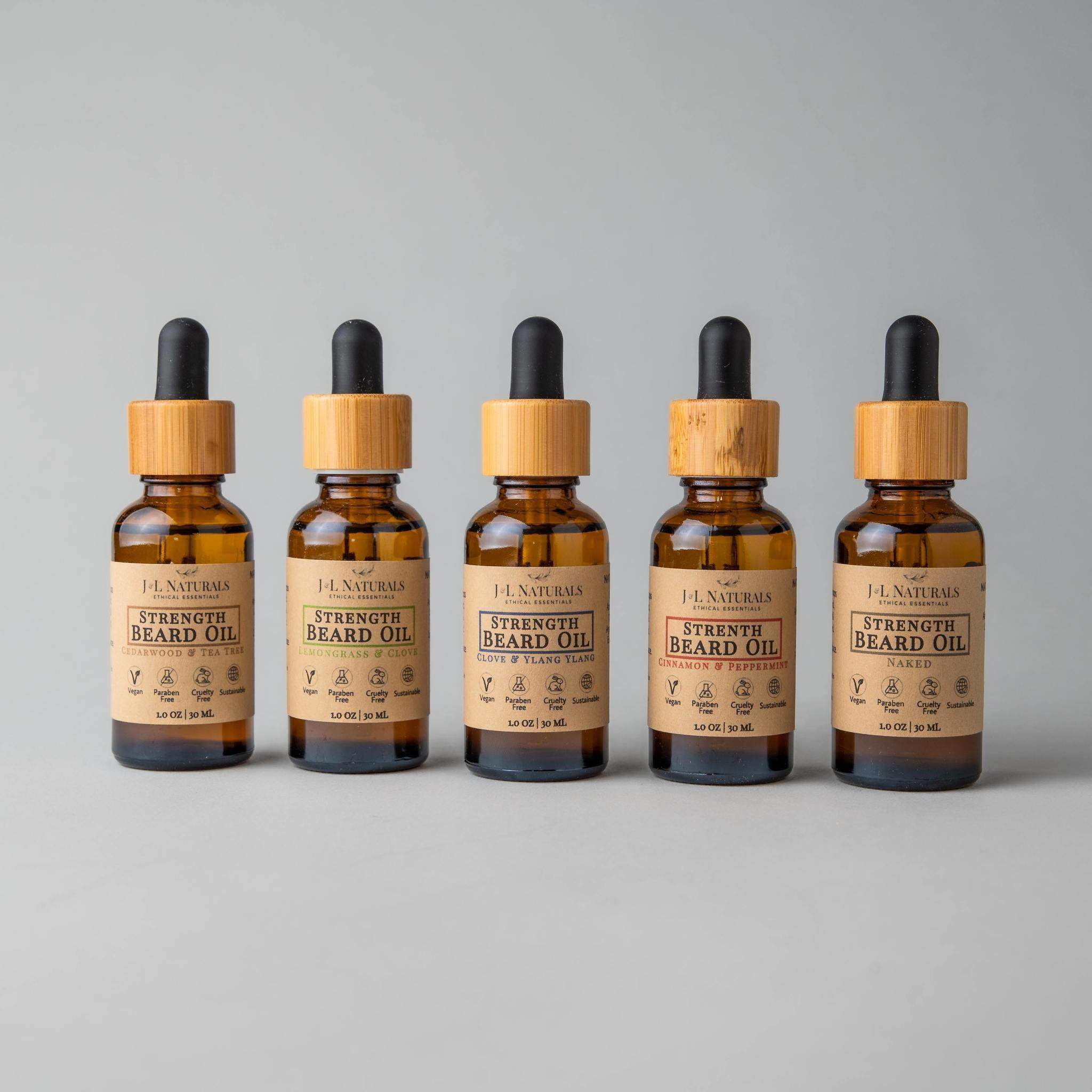 Beard Oil Bundle featuring five bottles of premium grooming oils in various scents, designed for beard care and growth.