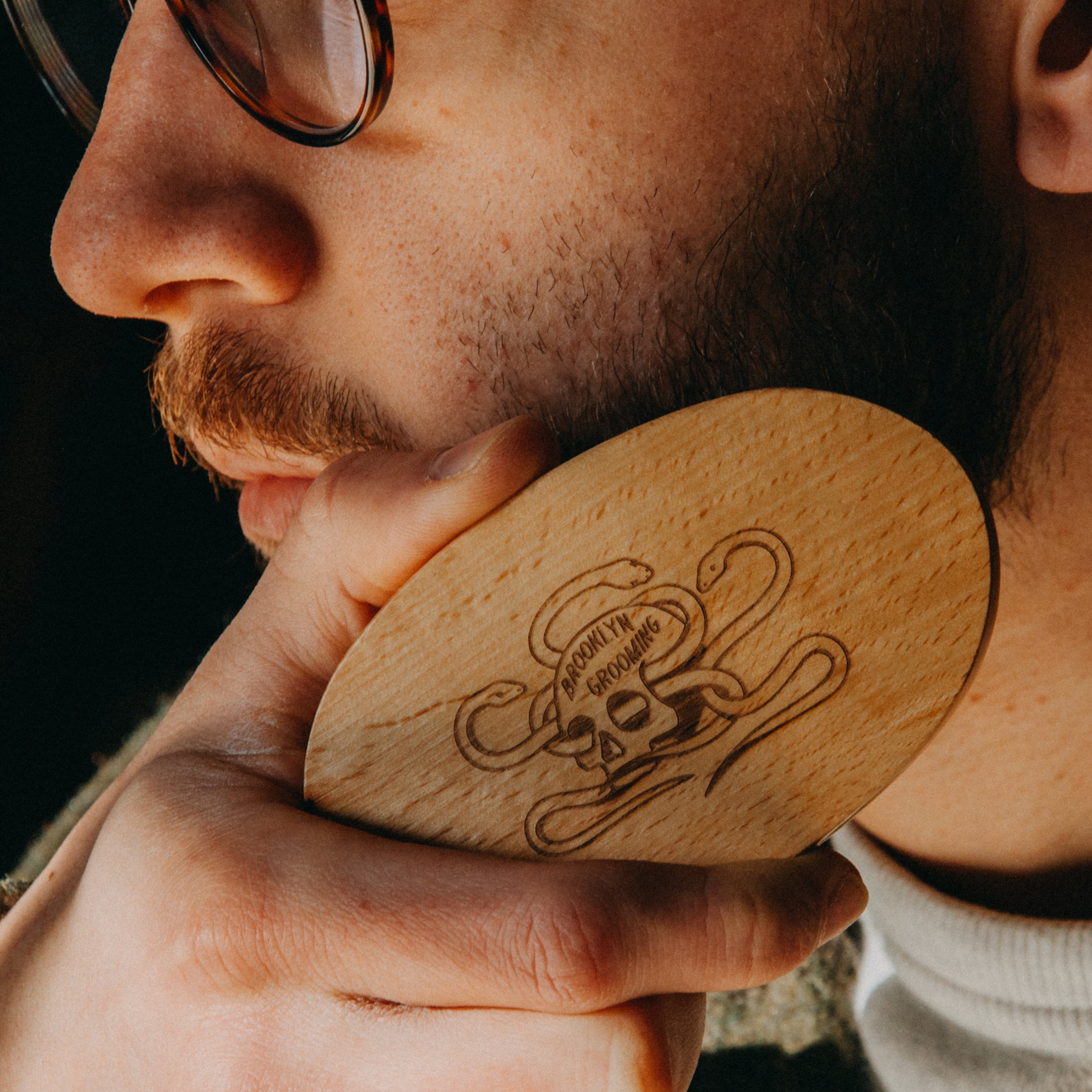 Beechwood and Boar Bristle Beard Brush with hand-carved wooden base and natural bristles for grooming beards.