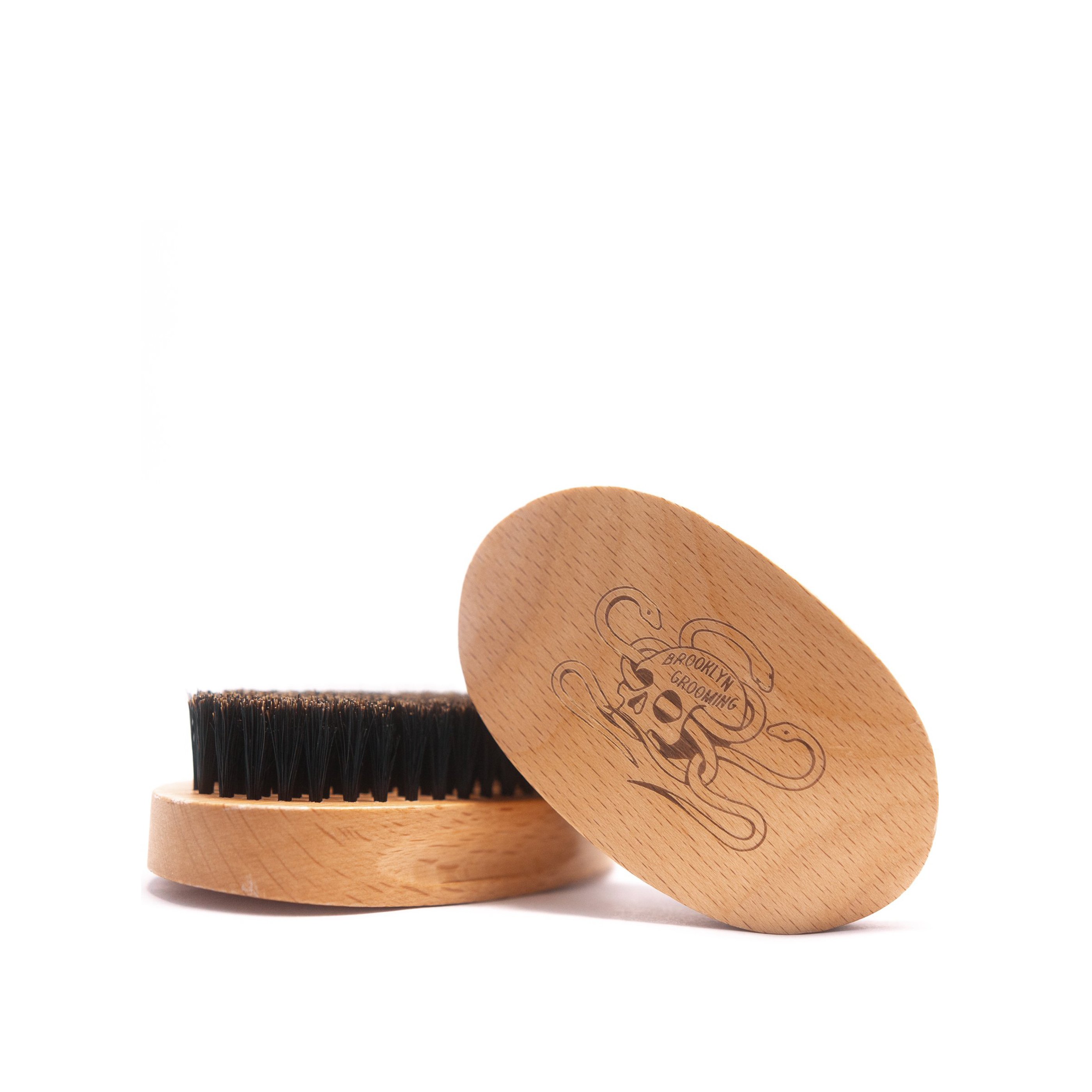 Beechwood and Boar Bristle Beard Brush with hand-carved wooden base and natural bristles for grooming beards.