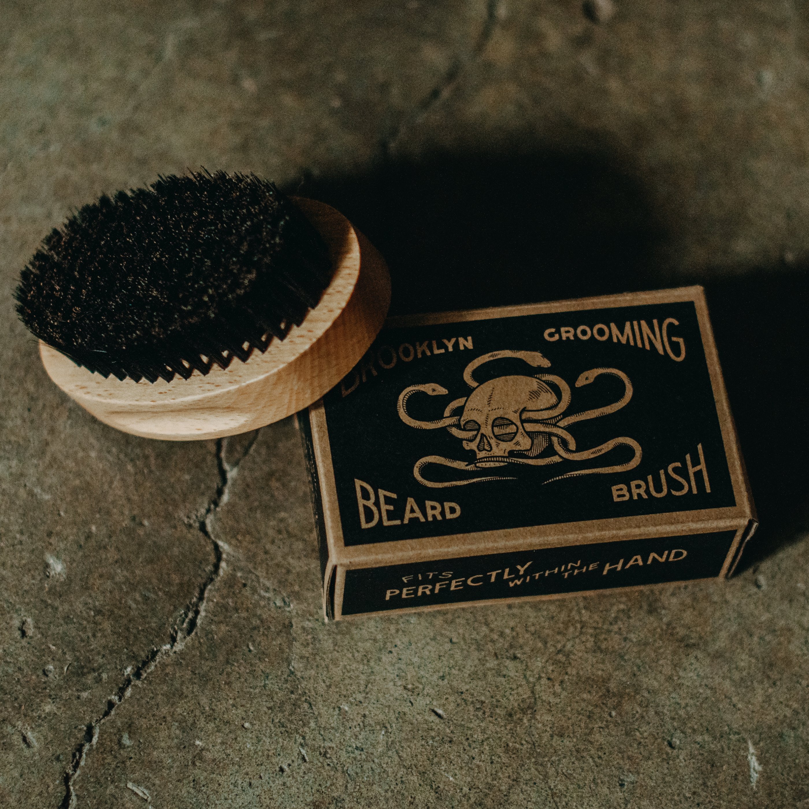 Beechwood and Boar Bristle Beard Brush with hand-carved wooden base and natural bristles for grooming beards.