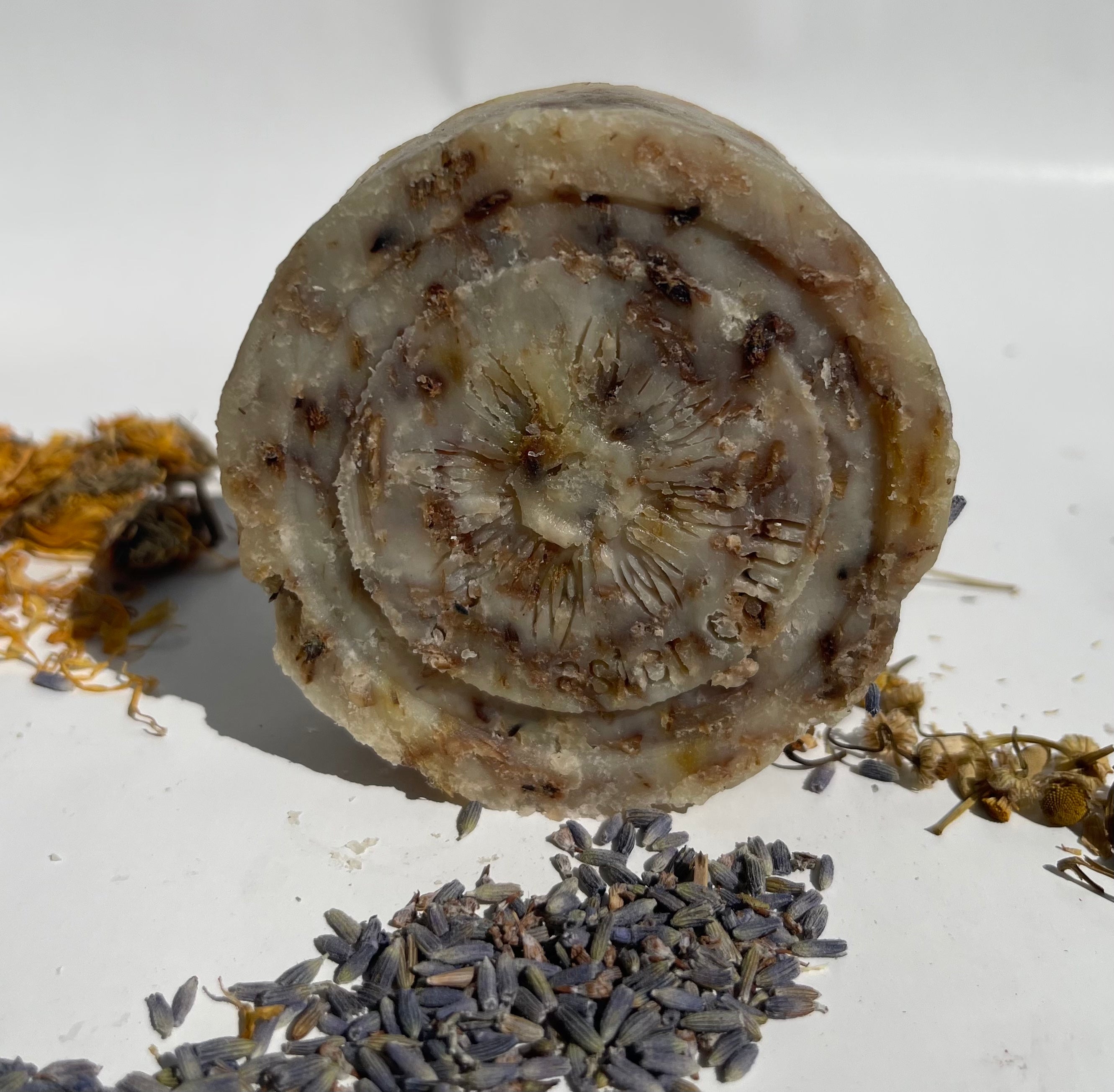 A beautifully crafted Bedtime Soap Blend bar featuring lavender, oatmeal, chamomile, and calendula, perfect for relaxation.