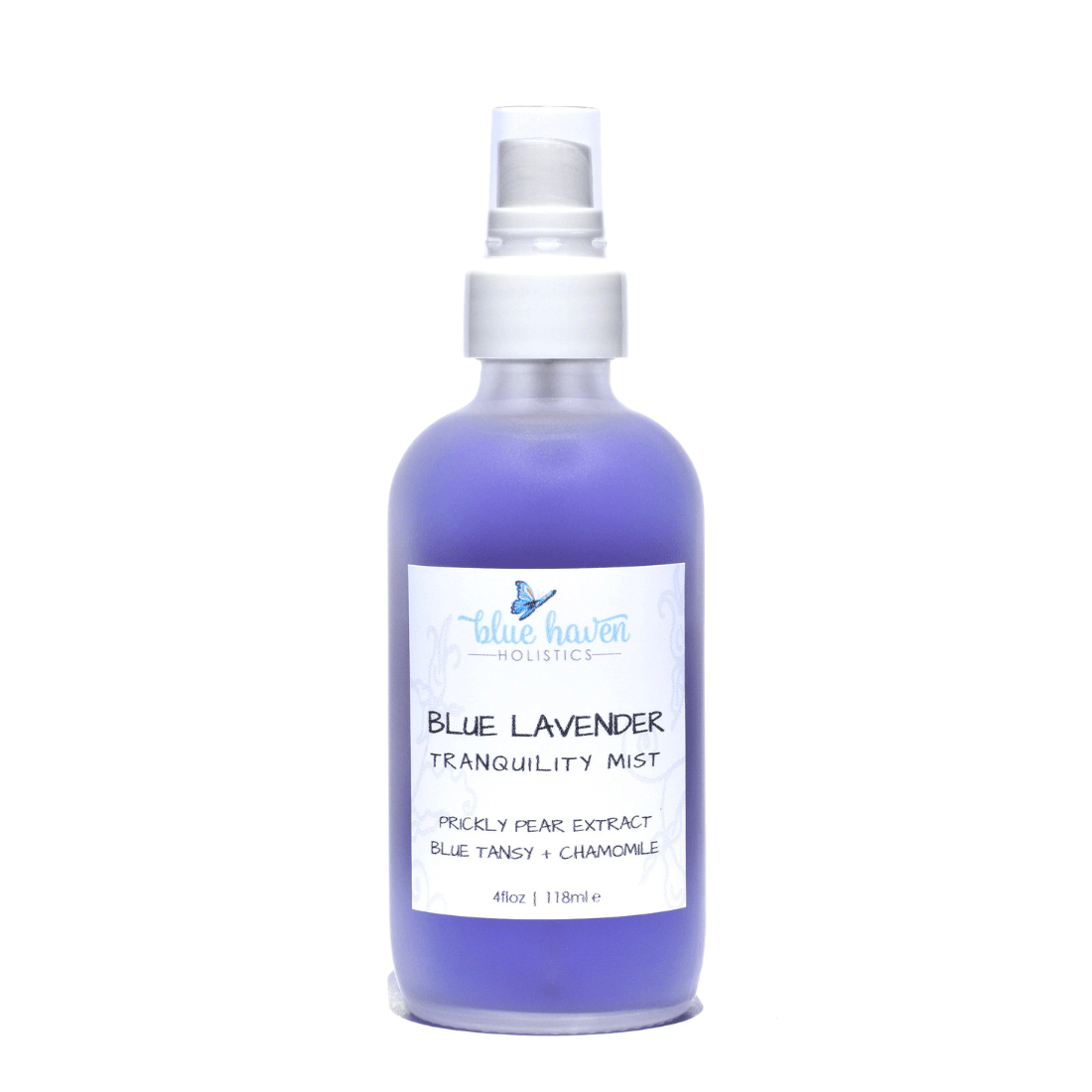 Blue Tansy Hydrating Face Mist bottle with a calming blue hue, surrounded by lavender and chamomile flowers, showcasing its natural ingredients.