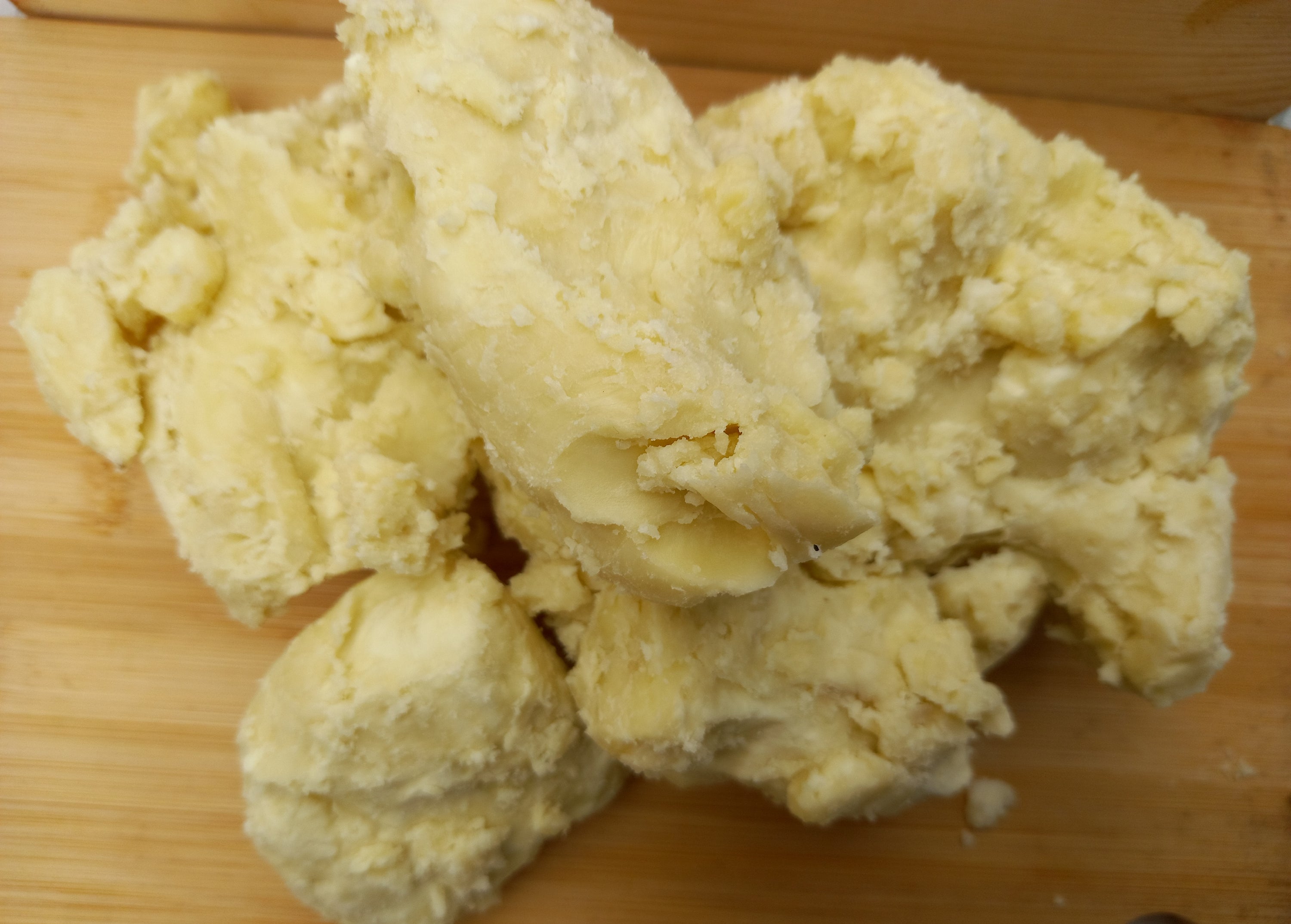 Chunks of raw shea butter.