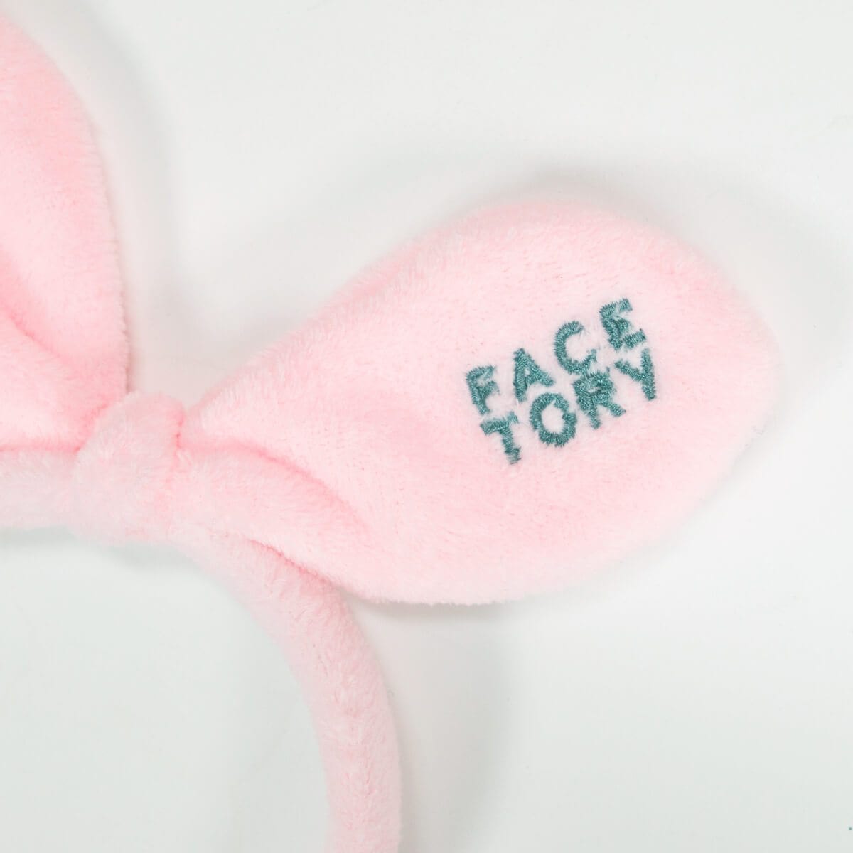 Blushing Pink Bunny Bow Hairband, perfect for skincare routines, featuring a cute bunny bow design.