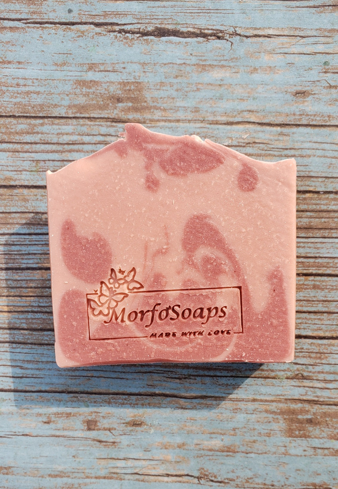 Handmade Calamine Soap bar with lavender and peppermint scent, featuring a unique artisanal design.