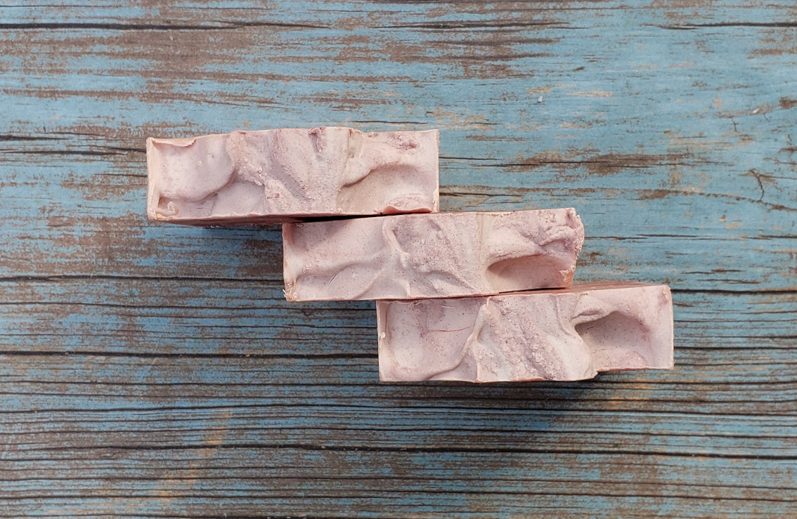 Handmade Calamine Soap bar with lavender and peppermint scent, featuring a unique artisanal design.