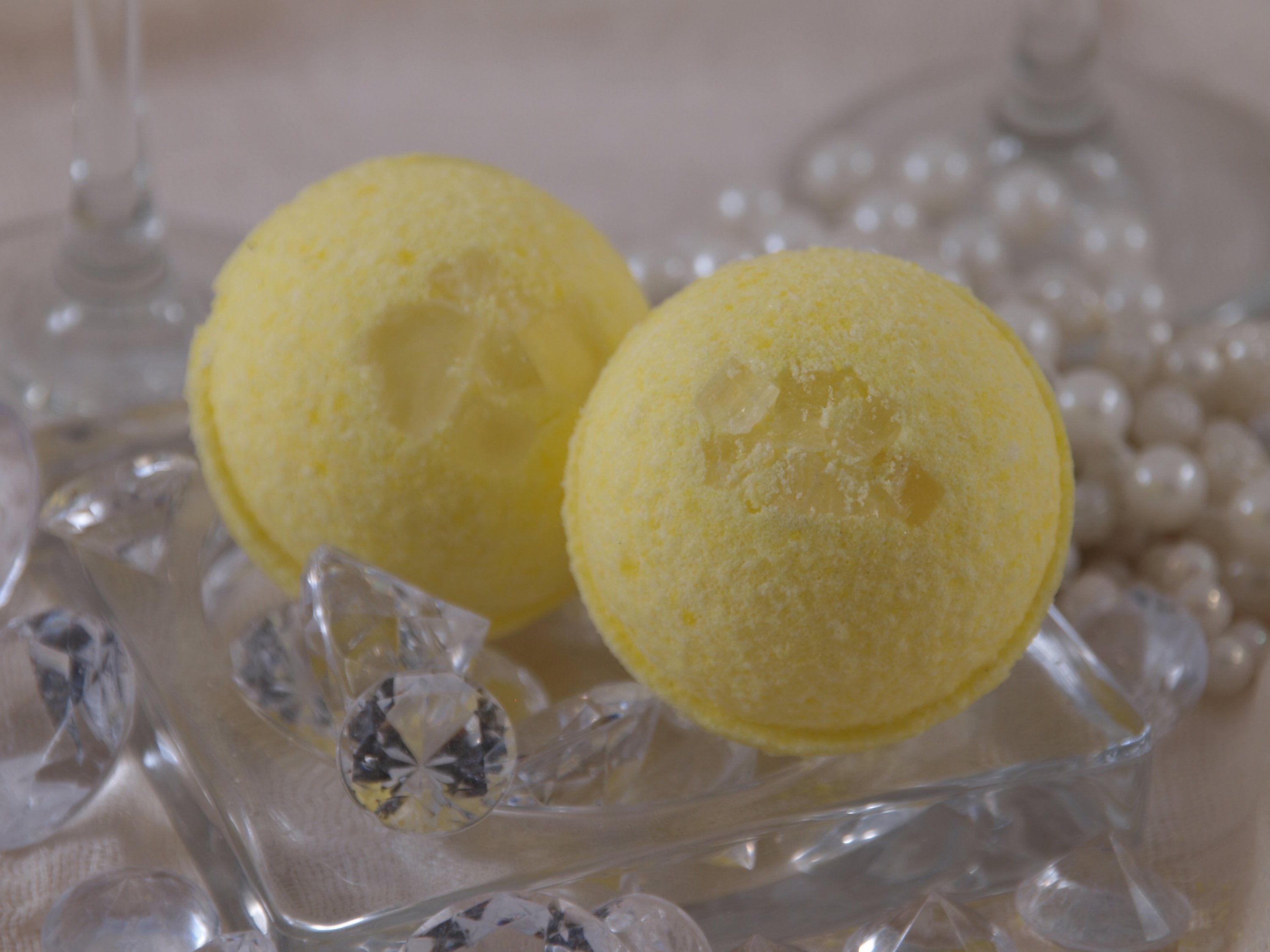 Champagne Ice Bath Bomb in vibrant colors, showcasing its effervescent fizz and luxurious design.