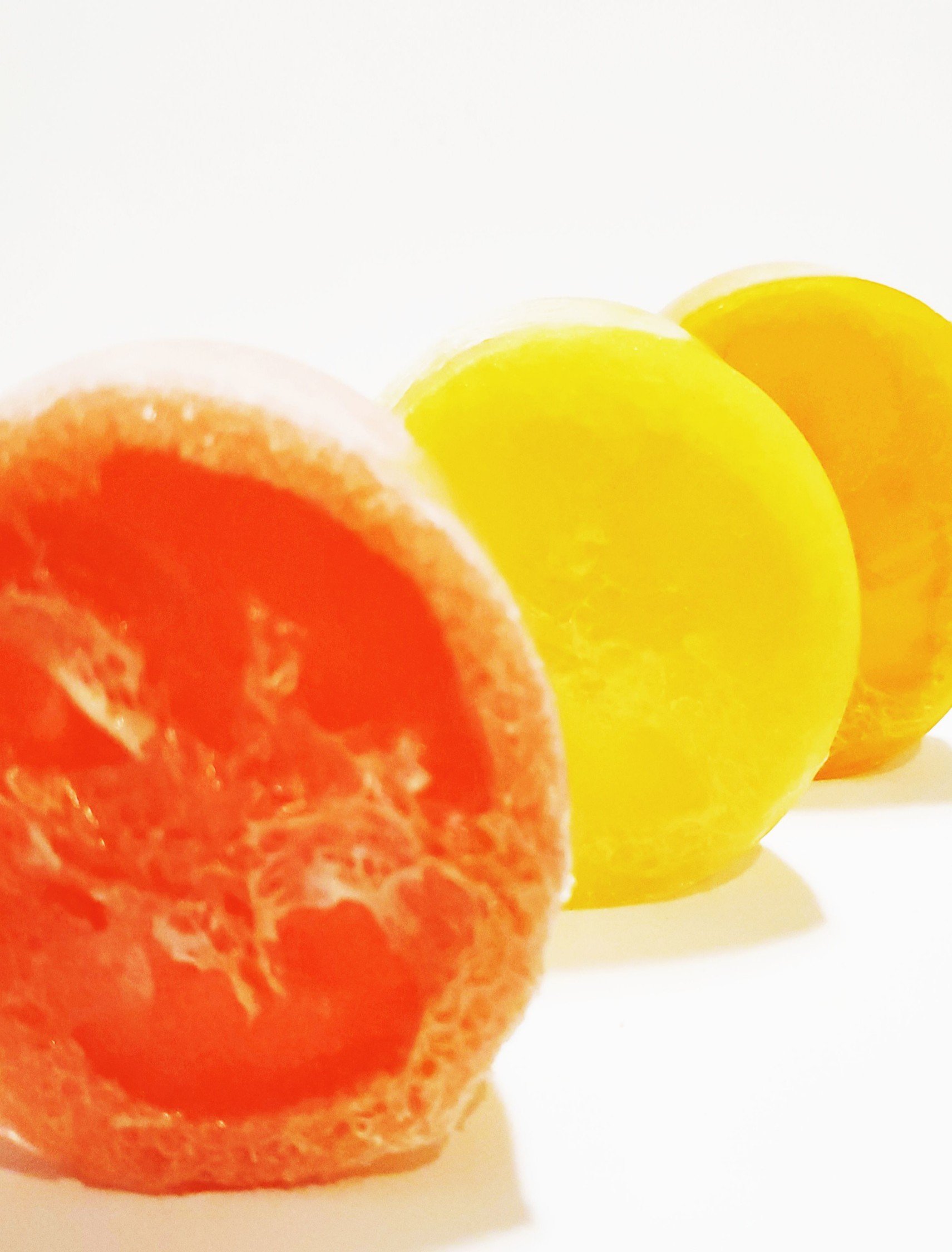 Citrus Loofah Set featuring exfoliating loofahs and honey soap in vibrant citrus colors.